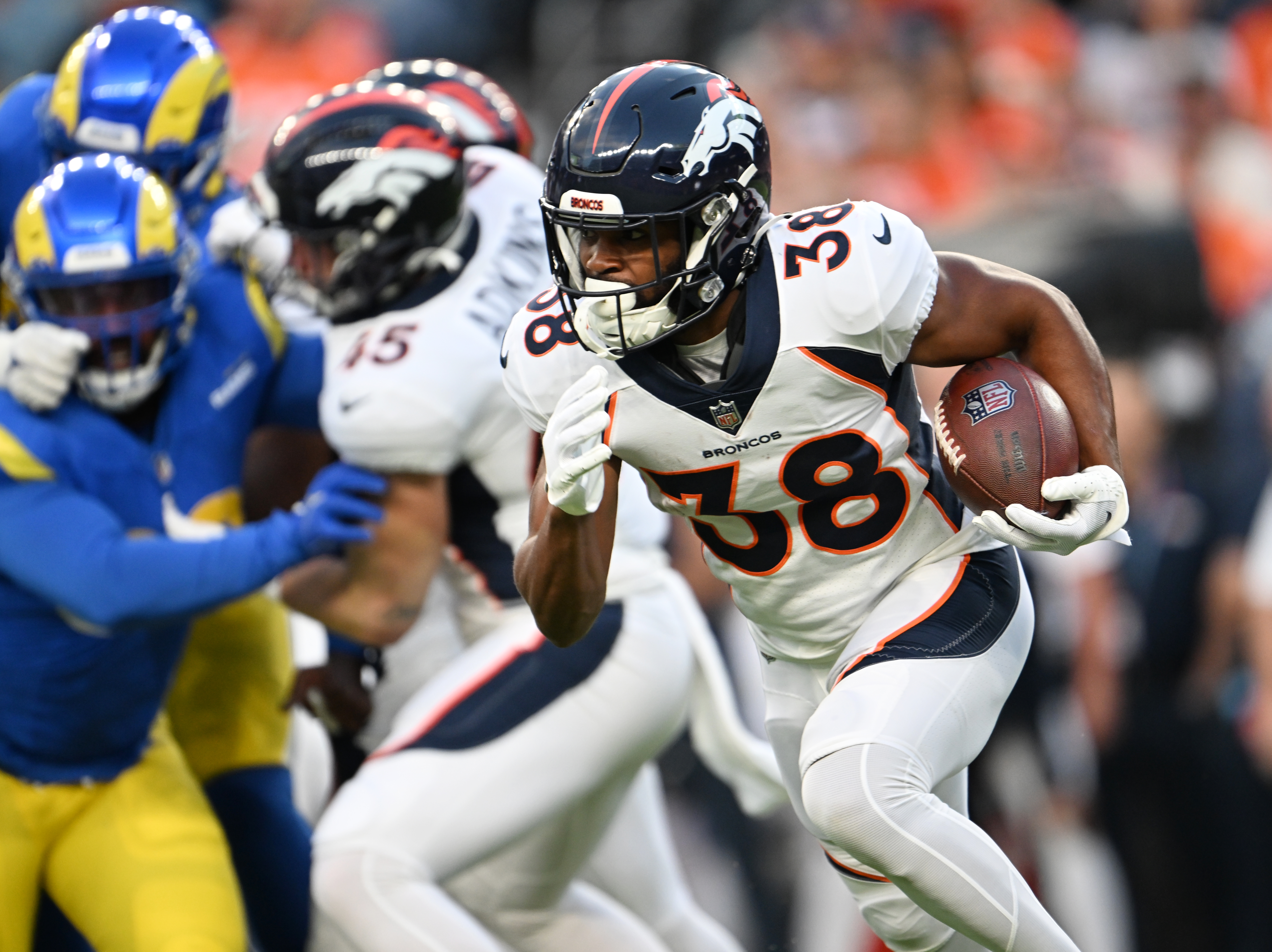Denver Broncos running back Jaleel McLaughlin (38) runs the ball downfield during the first quarter at Empower Field on August 26, 2023, in Denver. The Denver Broncos hosted the Los Angeles Rams during their third and final preseason game of the 2023 NFL season. (Photo by RJ Sangosti/The Denver Post)