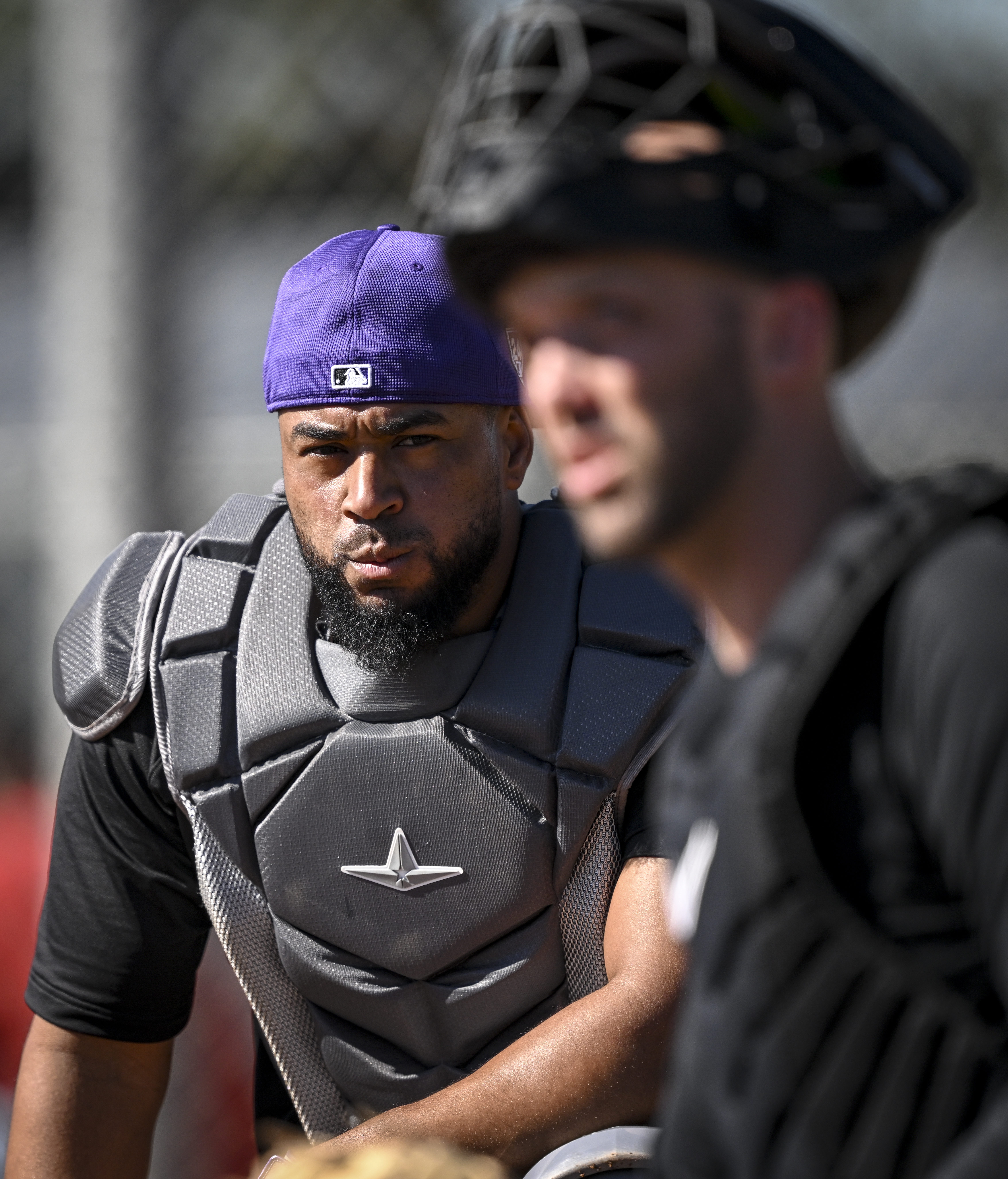 Elias Diaz (35) watches as Jacob Stallings (25) of the Colorado Rockies works behind the dish during Spring Training at Salt River Fields in Scottsdale, Arizona on Thursday, Feb. 22, 2024. (Photo by AAron Ontiveroz/The Denver Post)
