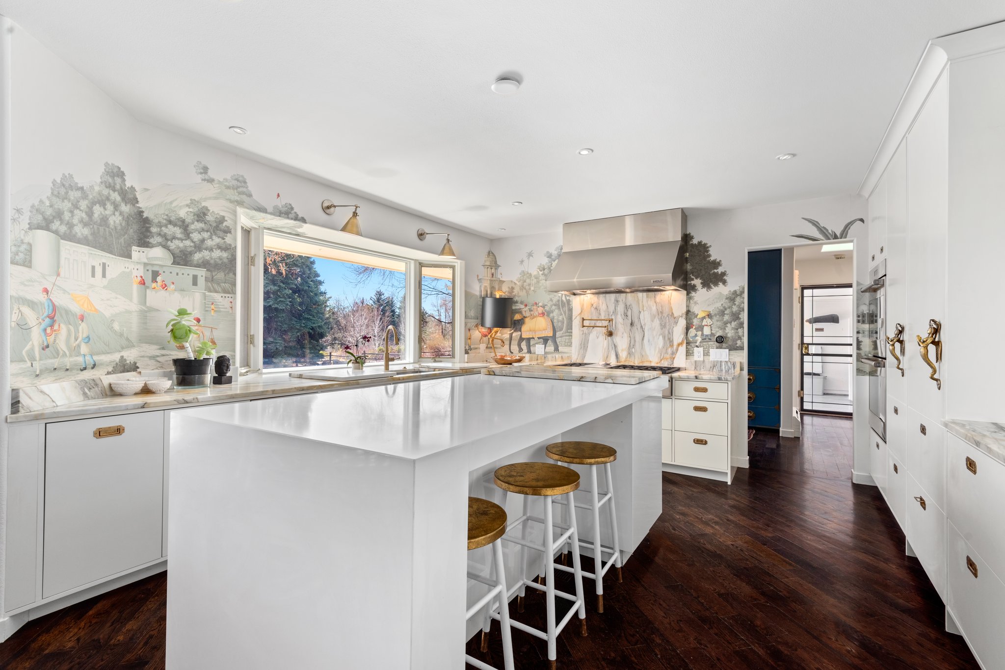 The renovated kitchen features Calcutta marble countertops and custom cabinets with walnut interiors. (Provided by Denver Creative Group)