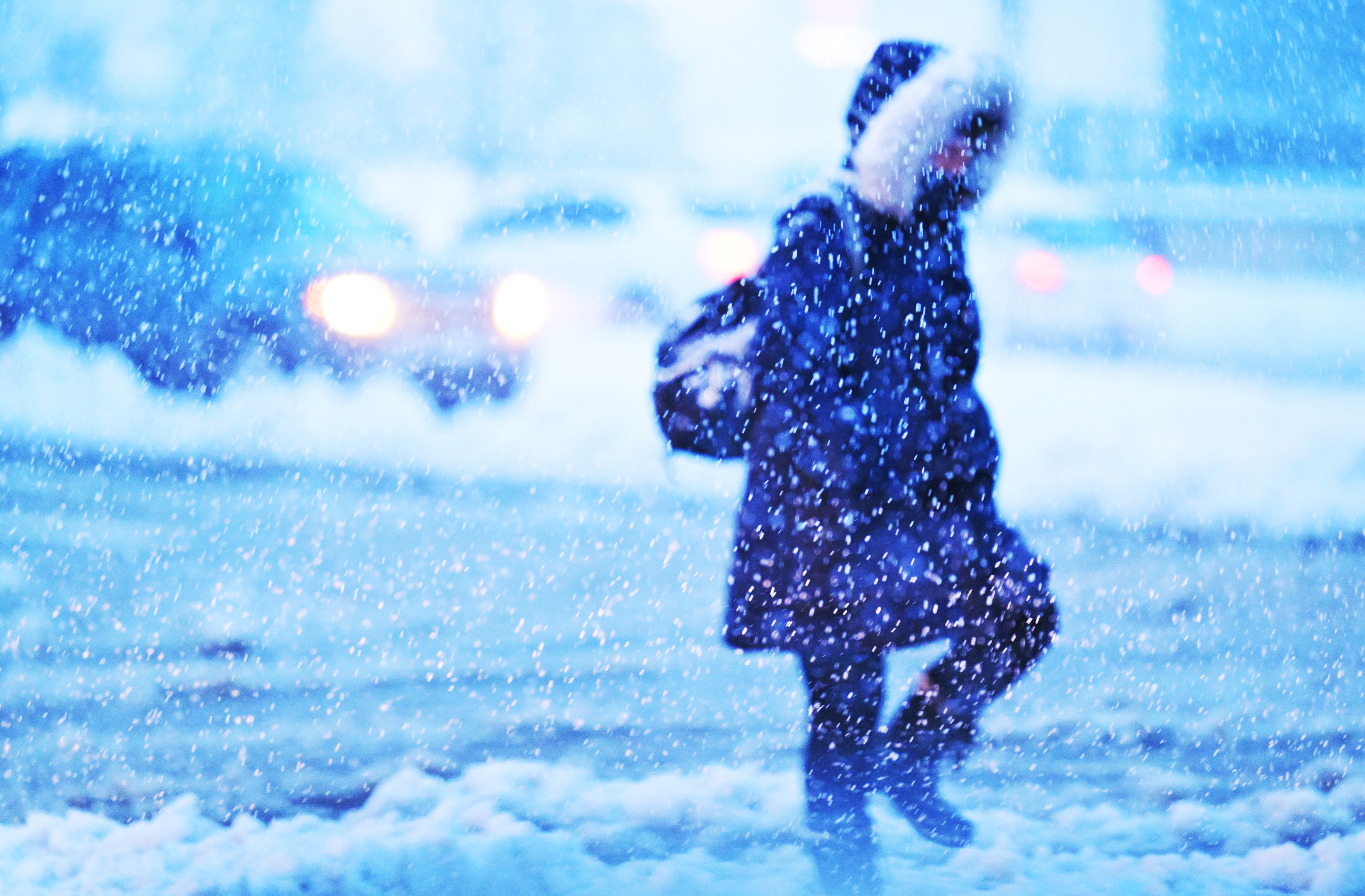 A pedestrian makes their way across West Colfax Ave. as a major snowstorm dumps snow in Lakewood on March 14, 2024. (Photo by RJ Sangosti/The Denver Post)