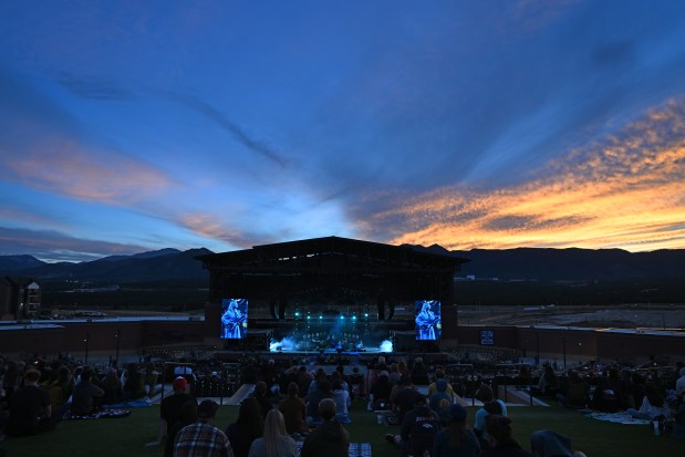As the sun sets, concert goers listen to Girl Tones play before the headlining band Cage the Elephant took the stage at the Ford Amphitheater in Colorado Springs, Colorado, on Sept. 19, 2024. (Photo by RJ Sangosti/The Denver Post)