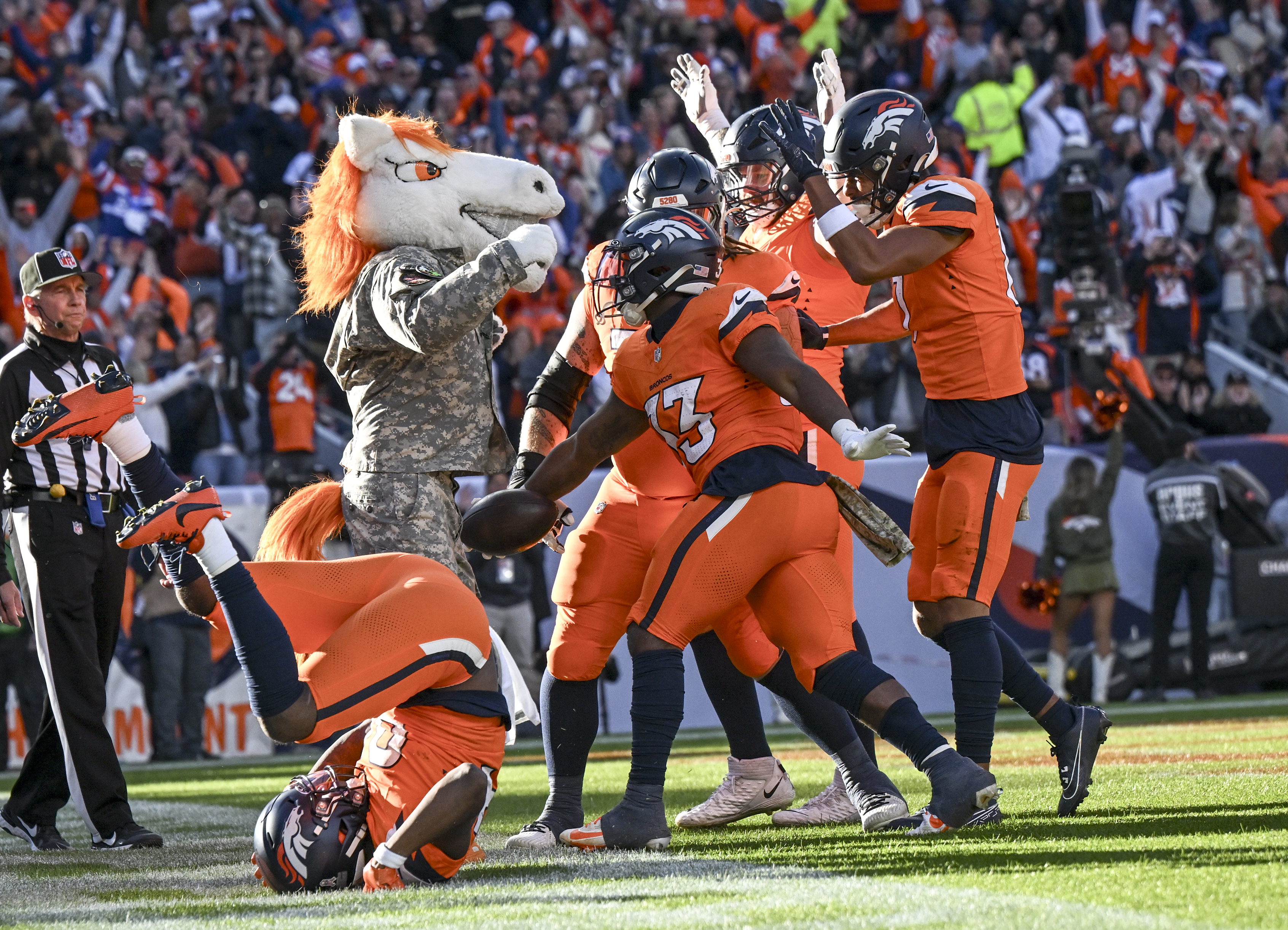 Javonte Williams (33) of the Denver Broncos celebrates with teammates after scoring a touchdown against the Atlanta Falcons during the second quarter at Empower Field at Mile High in Denver on Nov. 17, 2024. (Photo by AAron Ontiveroz/The Denver Post)