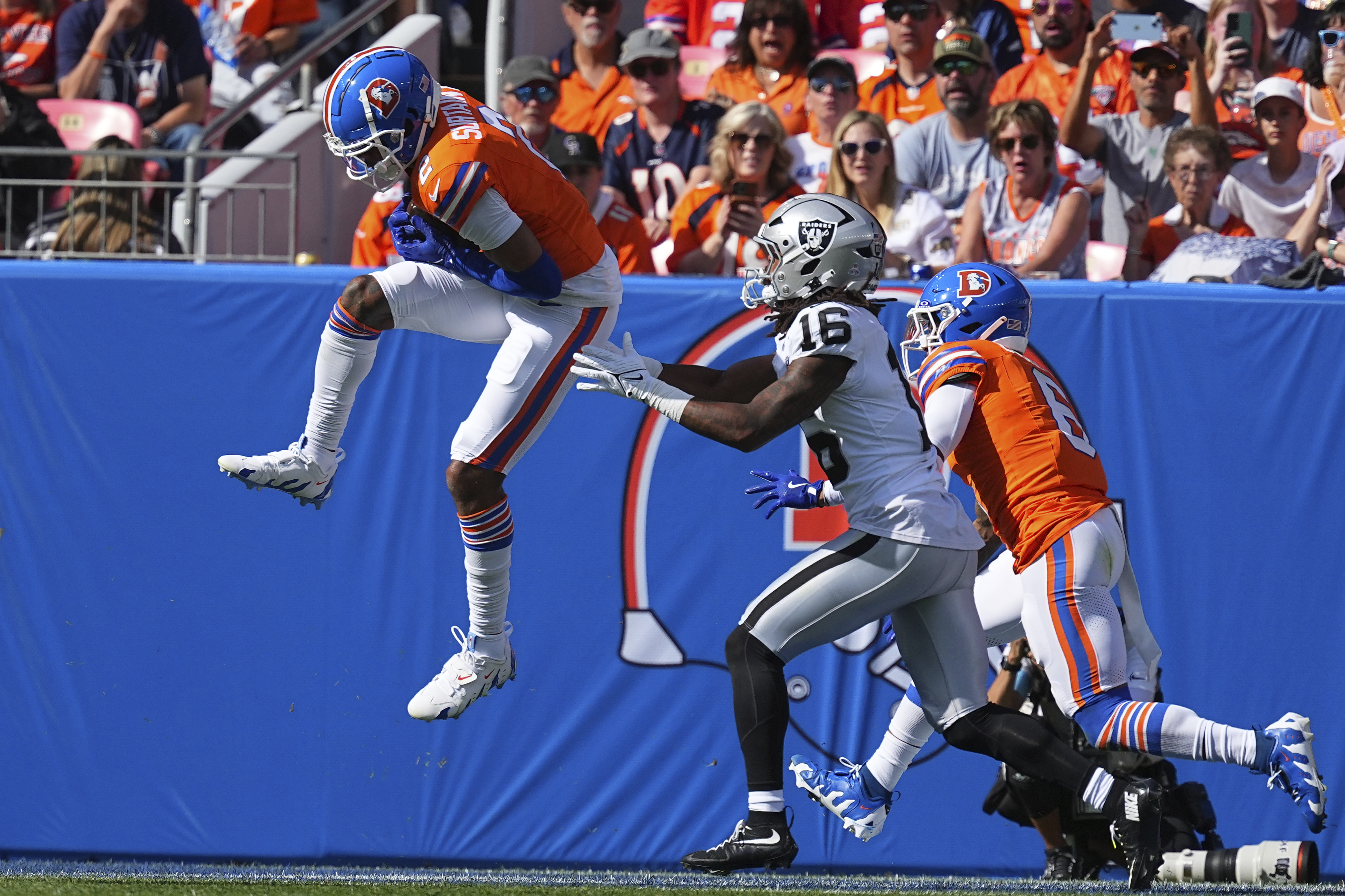 Denver Broncos cornerback Pat Surtain II (2) intercepts a pass for a 100 yard touchdown against the Las Vegas Raiders on Oct. 6, 2024, in Denver. (AP Photo/Bart Young)