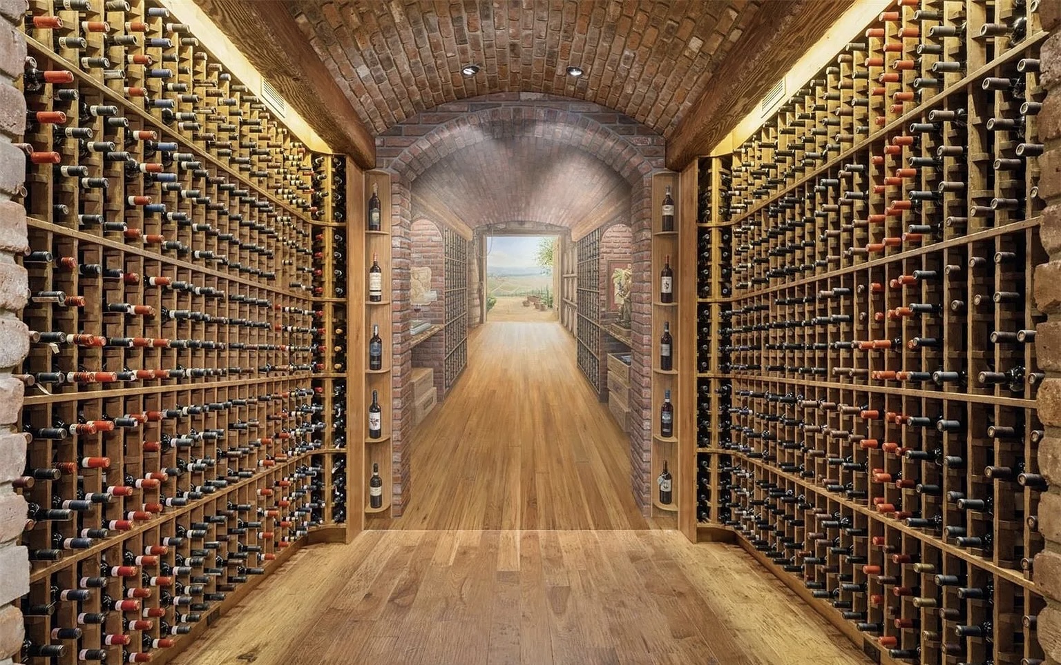 The brick wine cellar, which features a custom mural of the Italian countryside by artist Sheldon James, has space for 2,200 bottles. (Courtesy Way Up Media for LIV Sotheby's International Realty)