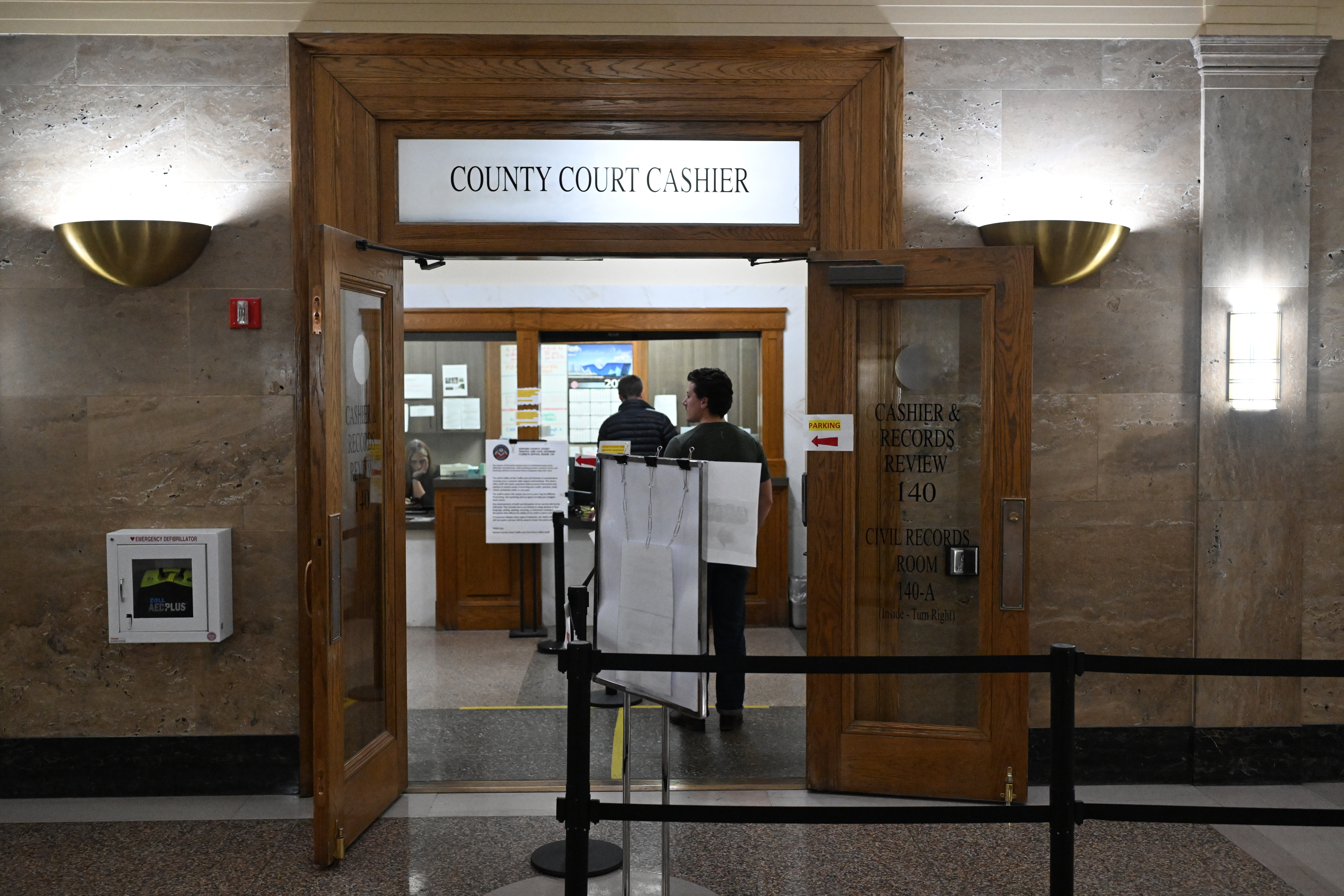 People line up to schedule parking ticket disputes with the municipal court at the Denver City and County Building in Denver on Feb. 3, 2026. The City of Denver recently eliminated an online parking dispute system. (Photo by RJ Sangosti/The Denver Post)
