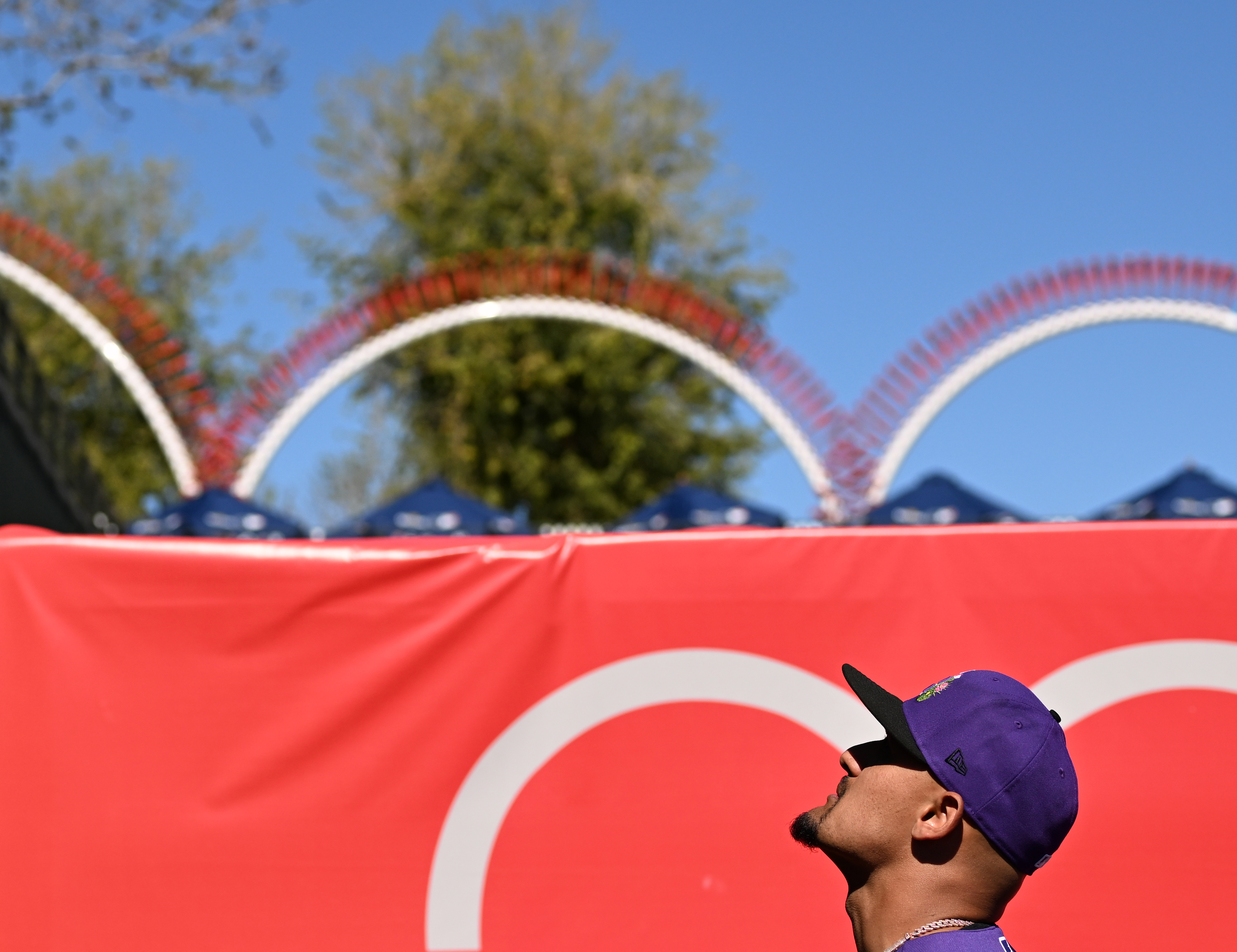 Pitcher Brennan Bernardino of the Colorado Rockies looks up to talk with a fan before a spring training game at Surprise Stadium in Surprise, Arizona on Feb. 22, 2026. (Photo by RJ Sangosti/The Denver Post)