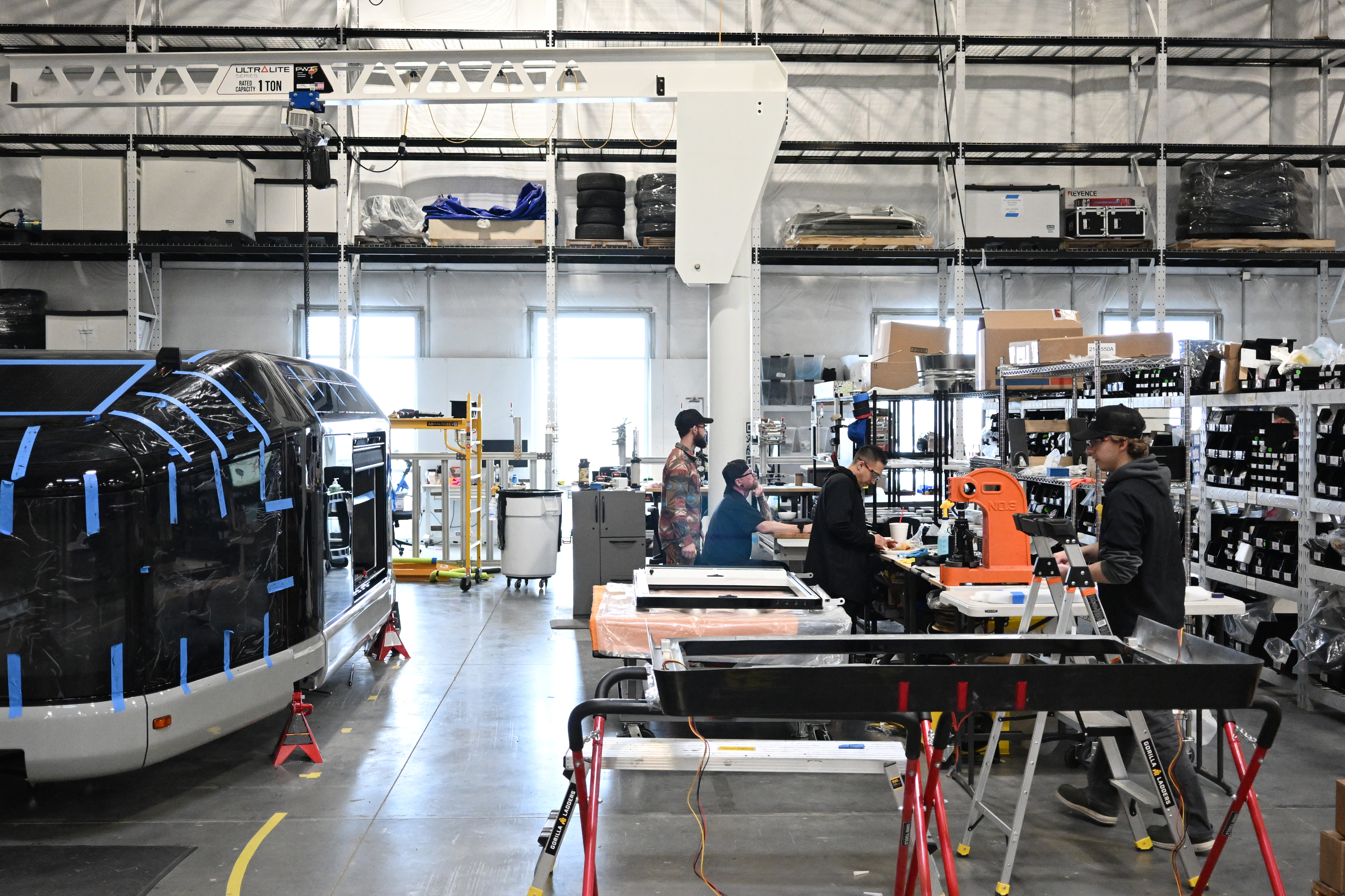 Employees work on building an electric camp trailer made by Lightship RV at the company's manufacturing facility in Broomfield, Colorado, on March 3, 2026. (Photo by RJ Sangosti/The Denver Post)