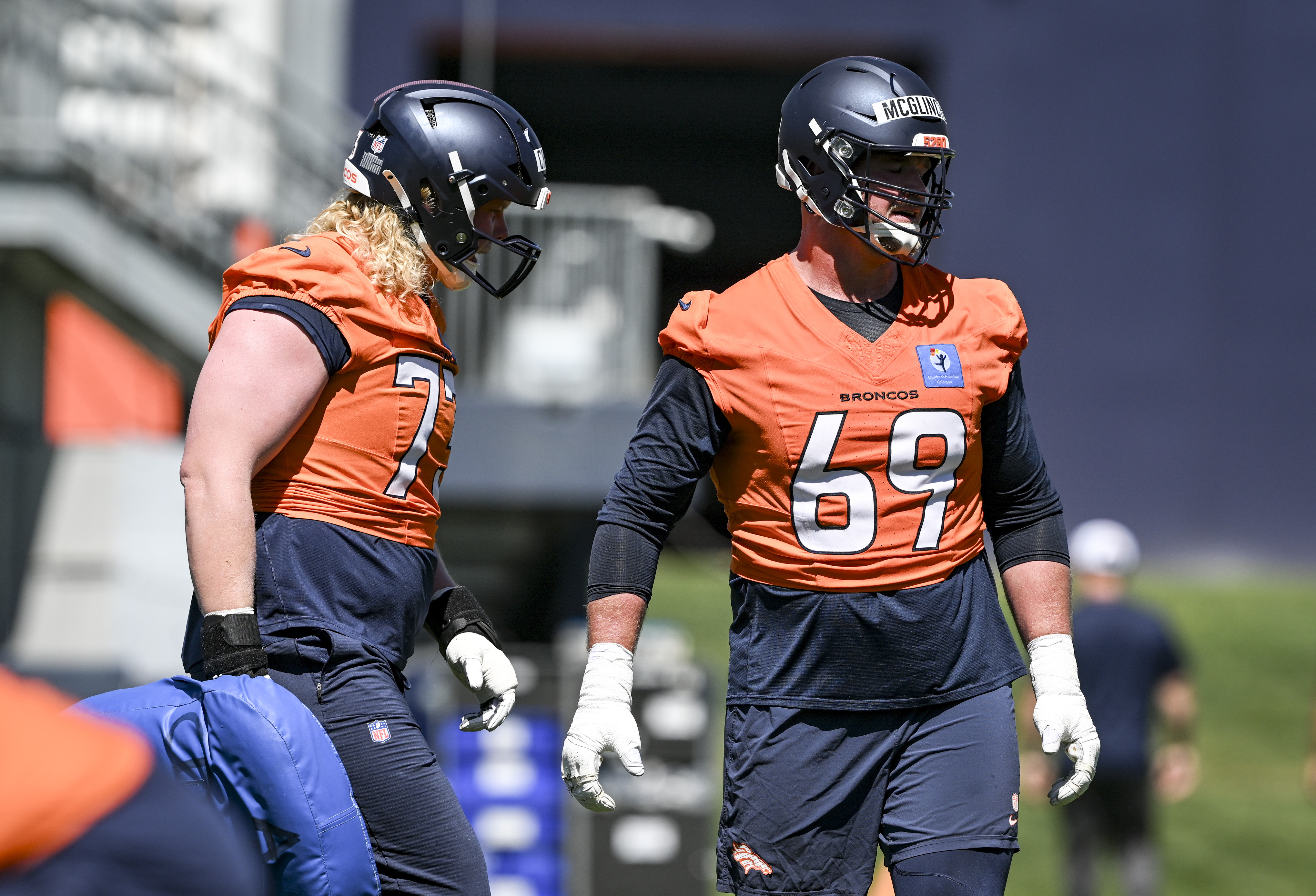 Frank Crum (73) and Mike McGlinchey (69) of the Denver Broncos work out with their group during OTAs at the Broncos Park in Centennial, Colorado on Thursday, June 4, 2026. (Photo by AAron Ontiveroz/The Denver Post)