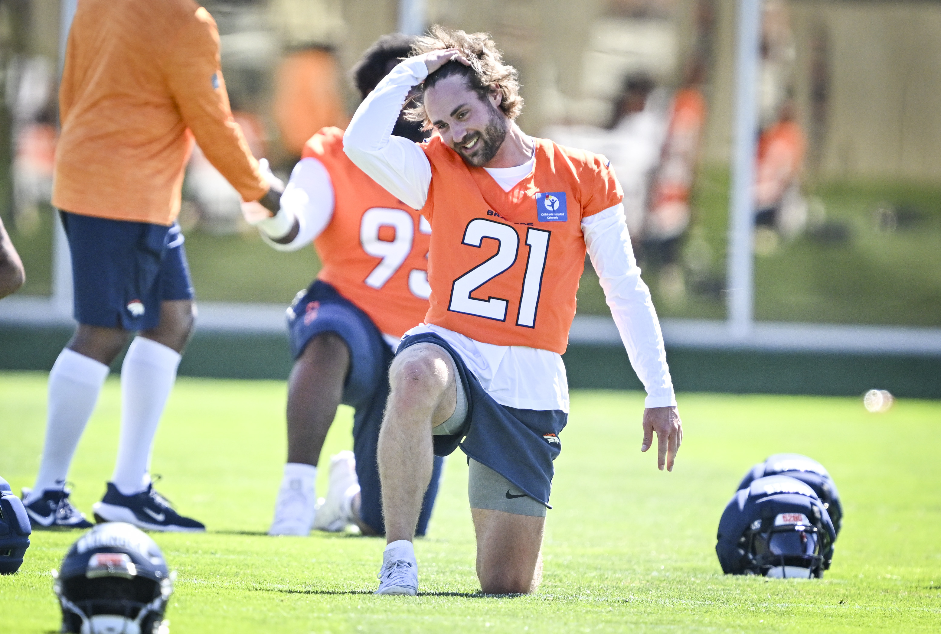 Riley Moss (21) of the Denver Broncos adjusts his hair as he stretches during practice at Broncos Park in Centennial, Colorado on Thursday, July 30, 2026. (Photo by AAron Ontiveroz/The Denver Post)