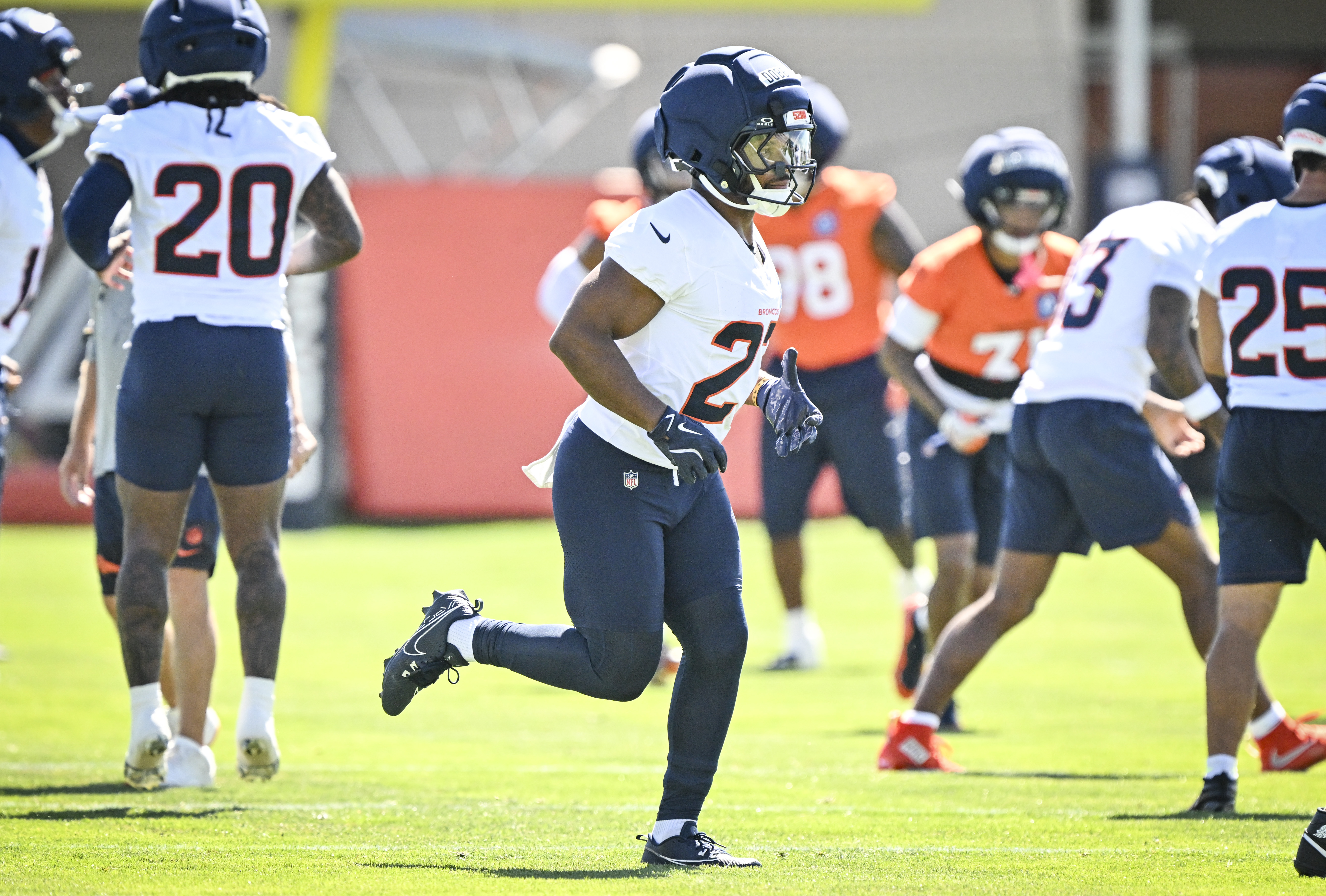 J.K. Dobbins (27) of the Denver Broncos jogs to his position group during practice at Broncos Park in Centennial, Colorado on Thursday, July 30, 2026. (Photo by AAron Ontiveroz/The Denver Post)