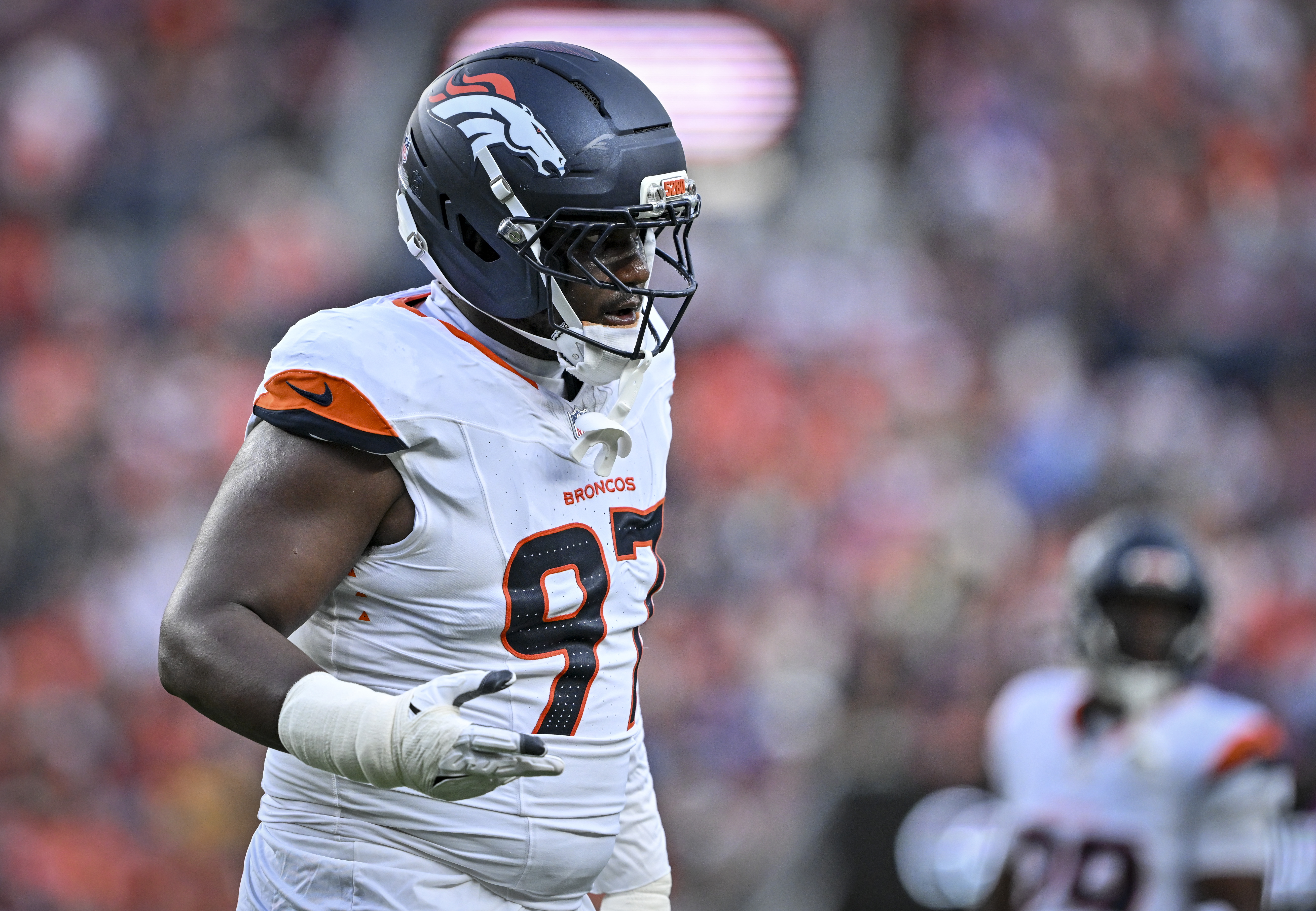 Malcolm Roach (97) of the Denver Broncos signals to the sideline between plays against the Green Bay Packers during the first quarter at Empower Field at Mile High in Denver, Colorado on Friday, August 21, 2026. (Photo by AAron Ontiveroz/The Denver Post)
