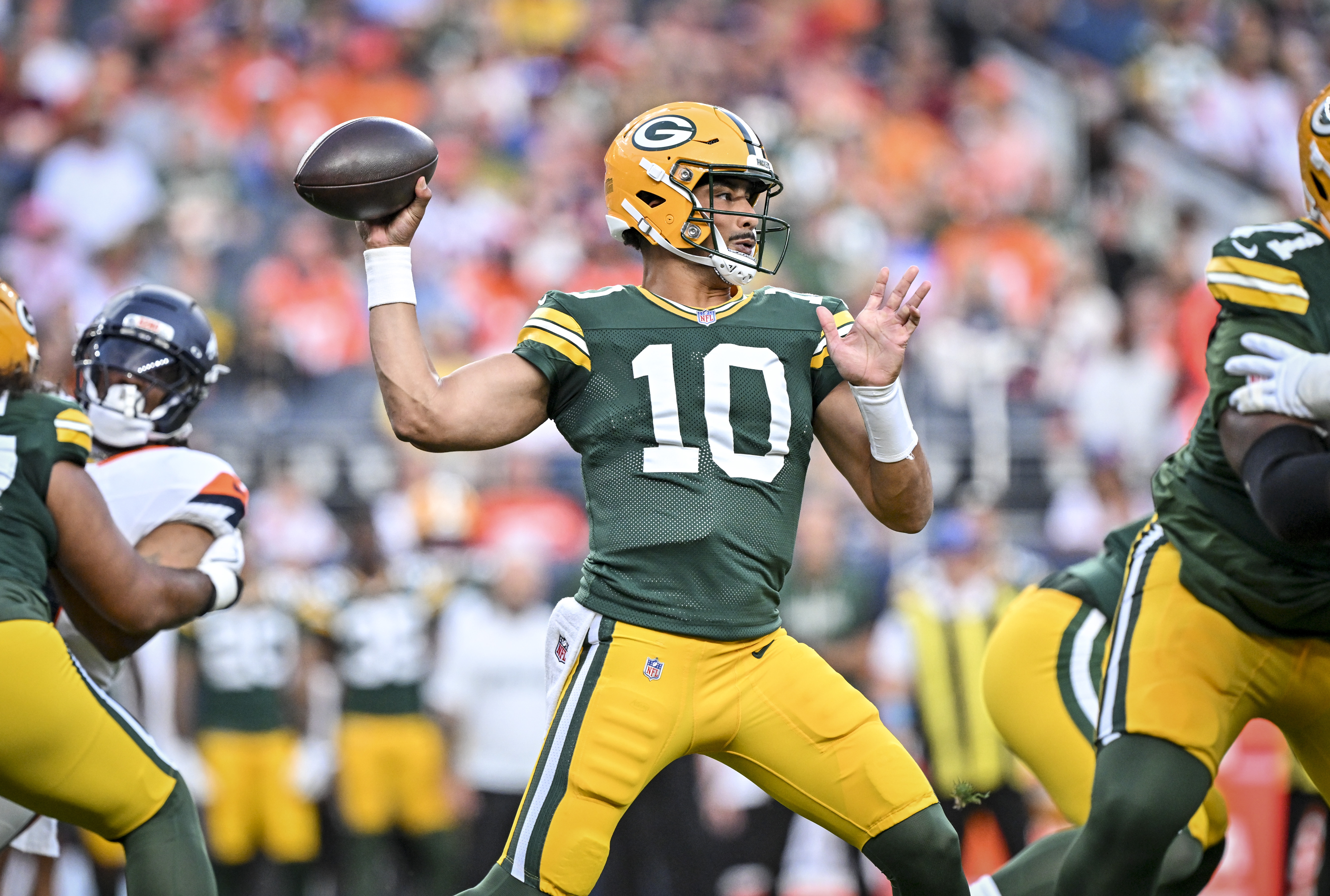 DENVER , CO - AUGUST 21: Jordan Love (10) of the Green Bay Packers throws against the Denver Broncos during the first quarter at Empower Field at Mile High in Denver, Colorado on Friday, August 21, 2026. (Photo by AAron Ontiveroz/The Denver Post)