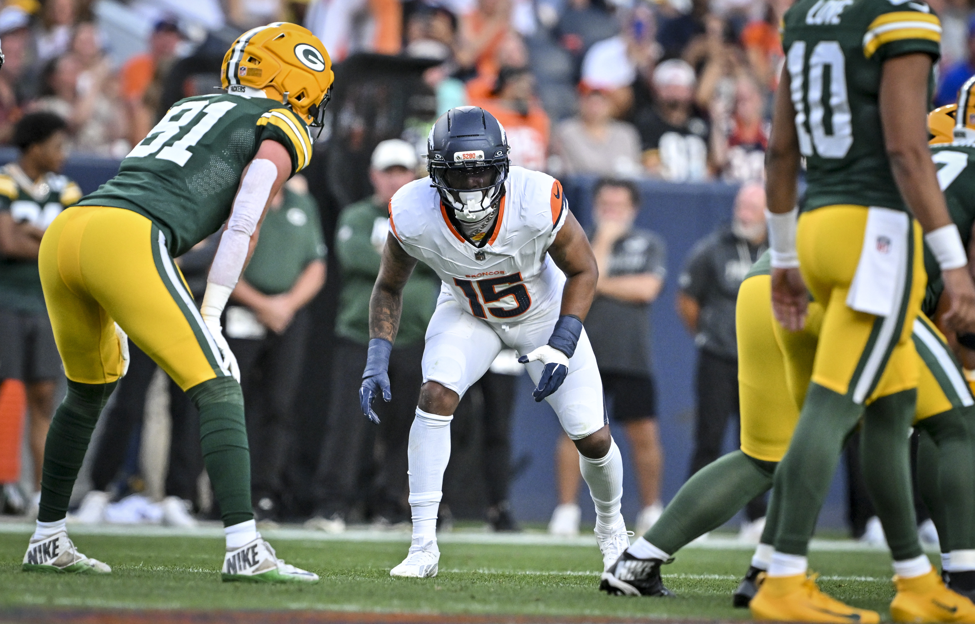Nik Bonitto (15) of the Denver Broncos lines up across from Josh Whyle (81) of the Green Bay Packers during the first quarter at Empower Field at Mile High in Denver, Colorado on Friday, August 21, 2026. (Photo by AAron Ontiveroz/The Denver Post)