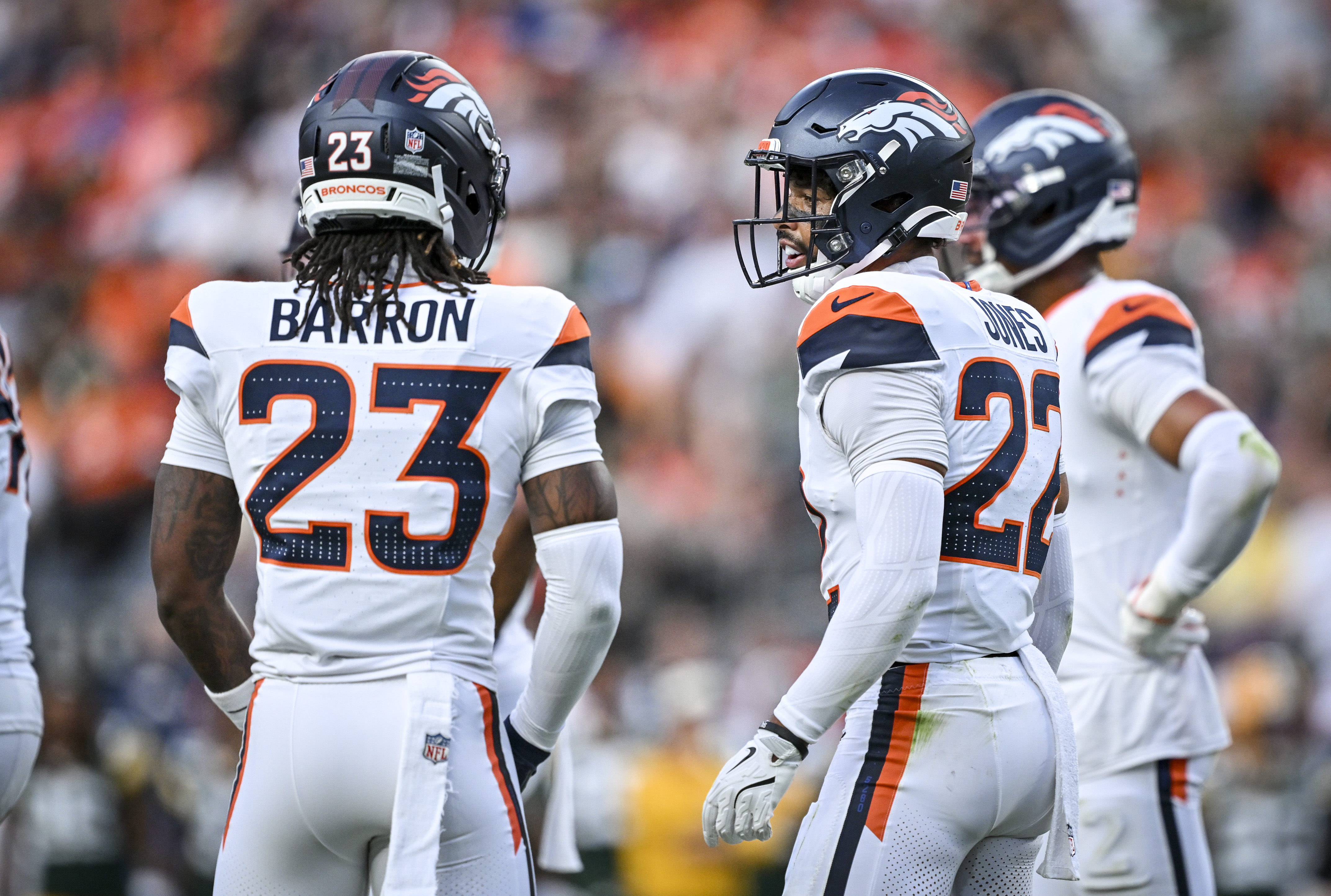 Brandon Jones (22) of the Denver Broncos talks to Jahdae Barron (23) during the first quarter against the Green Bay Packers at Empower Field at Mile High in Denver, Colorado on Friday, August 21, 2026. (Photo by AAron Ontiveroz/The Denver Post)