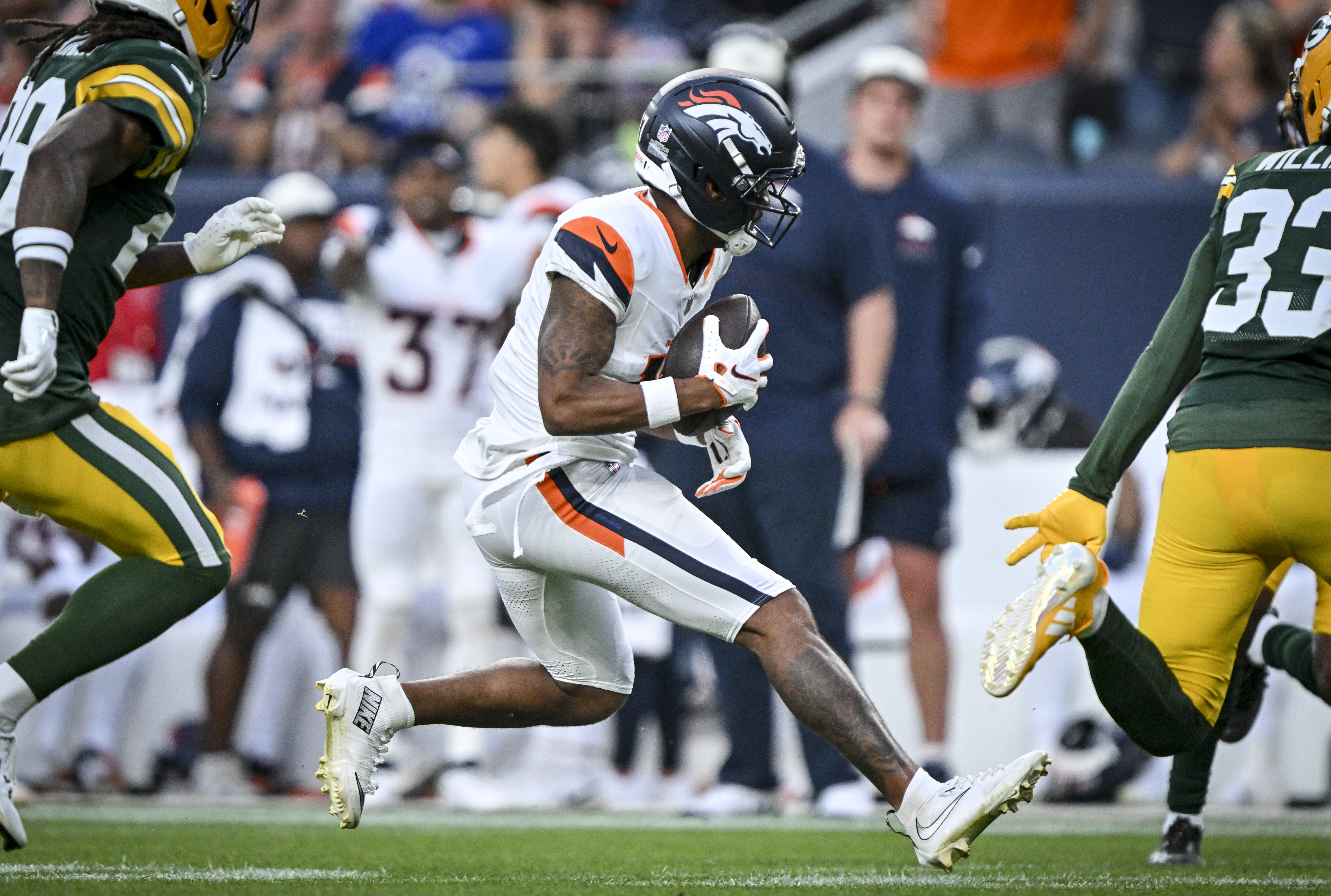 Jaylen Waddle (17) of the Denver Broncos runs after making a catch against the Green Bay Packers during the first quarter at Empower Field at Mile High in Denver, Colorado on Friday, August 21, 2026. (Photo by AAron Ontiveroz/The Denver Post)