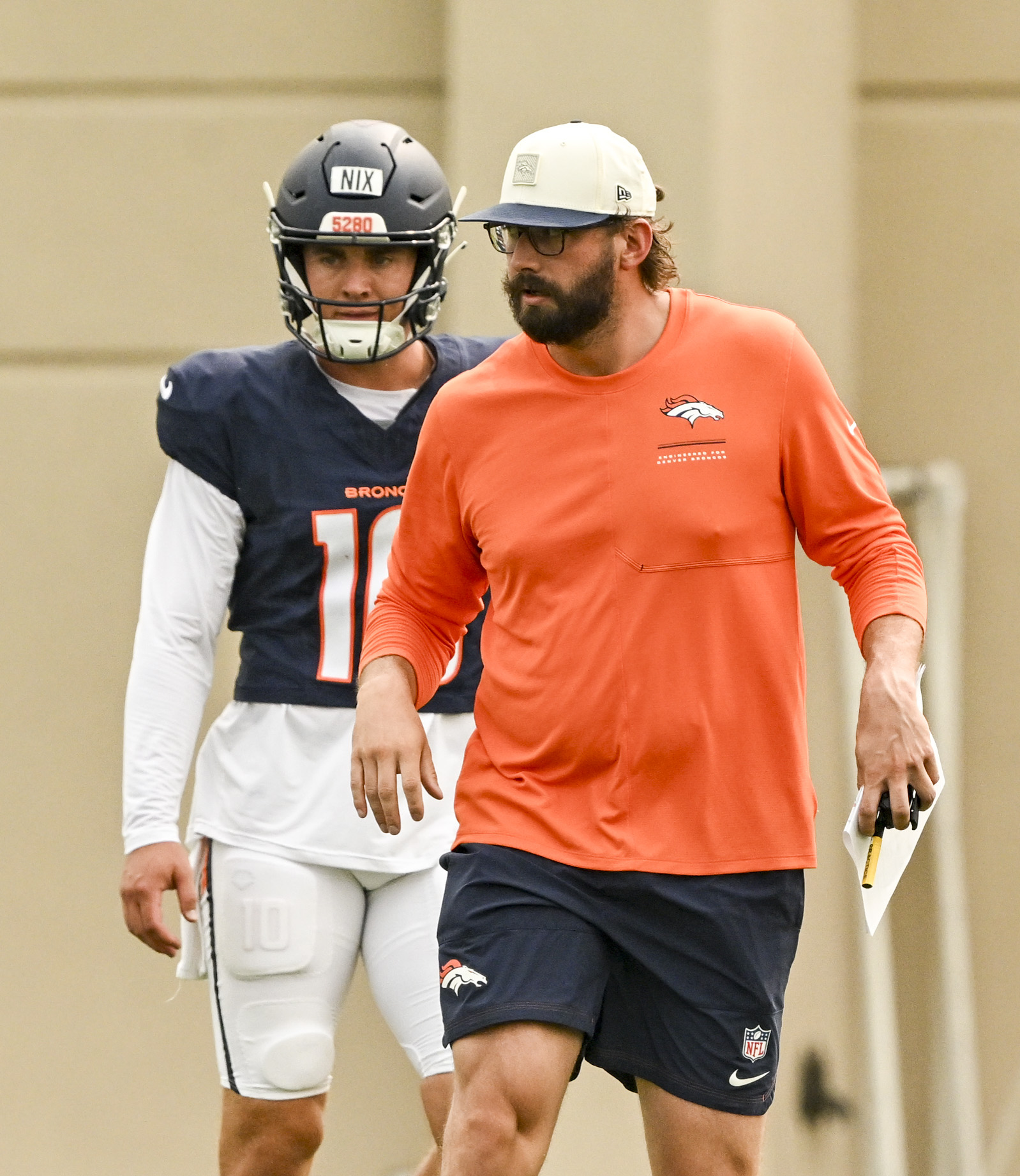Davis Webb and Bo Nix (10) of the Denver Broncos run through drills during training camp at Broncos Park in Centennial on Monday, Aug. 3, 2026. (Photo by AAron Ontiveroz/The Denver Post)
