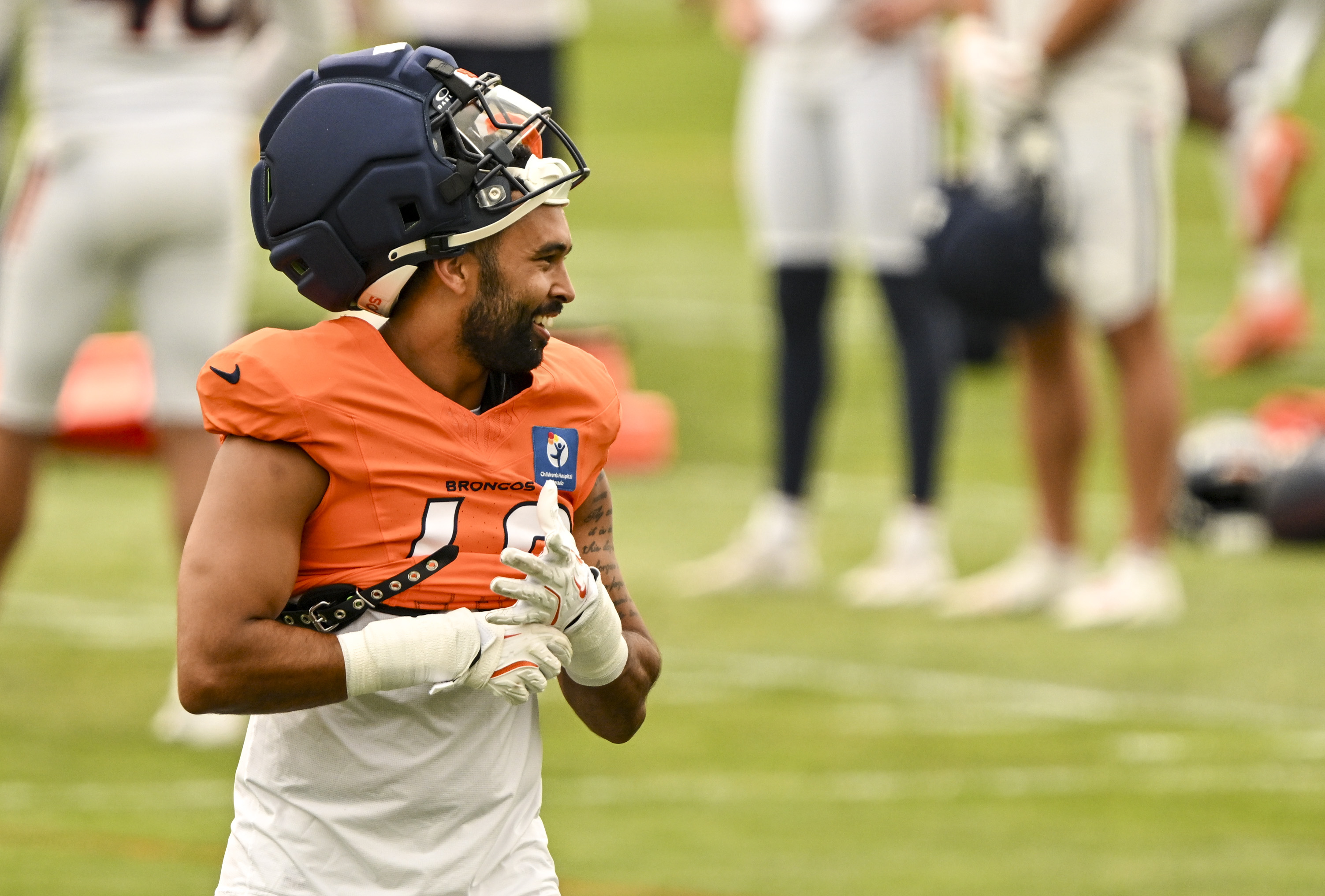 Justin Strnad (40) of the Denver Broncos jokes with teammates during training camp at Broncos Park in Centennial, Colorado on Monday, Aug. 3, 2026. (Photo by AAron Ontiveroz/The Denver Post)