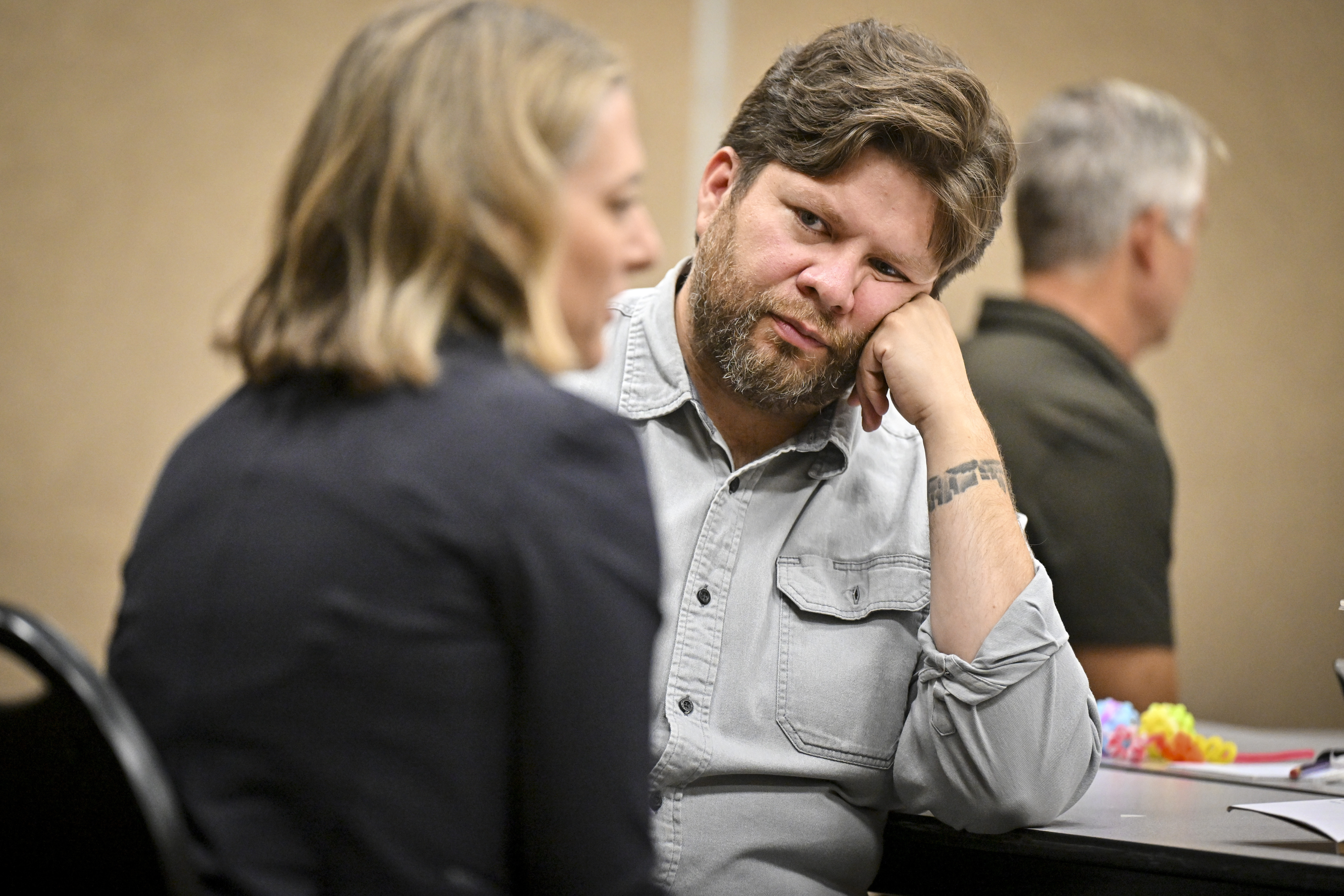 Denver Public Schools board member Donald "DJ" Torres speaks with fellow director Amy Klein Molk during a board retreat at the Denver Police Protective Association on Monday, August 17, 2026. (Photo by AAron Ontiveroz/The Denver Post)