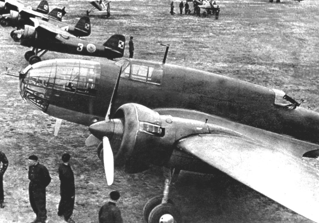 PZL.37 Łoś of the 1st Air Regiment with row of PZL P.11 fighters of the 111th and 112th Fighter Escadrilles