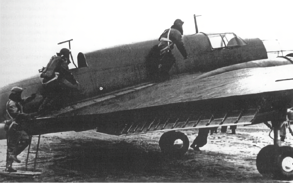 Crew members boarding a PZL.37B Łoś