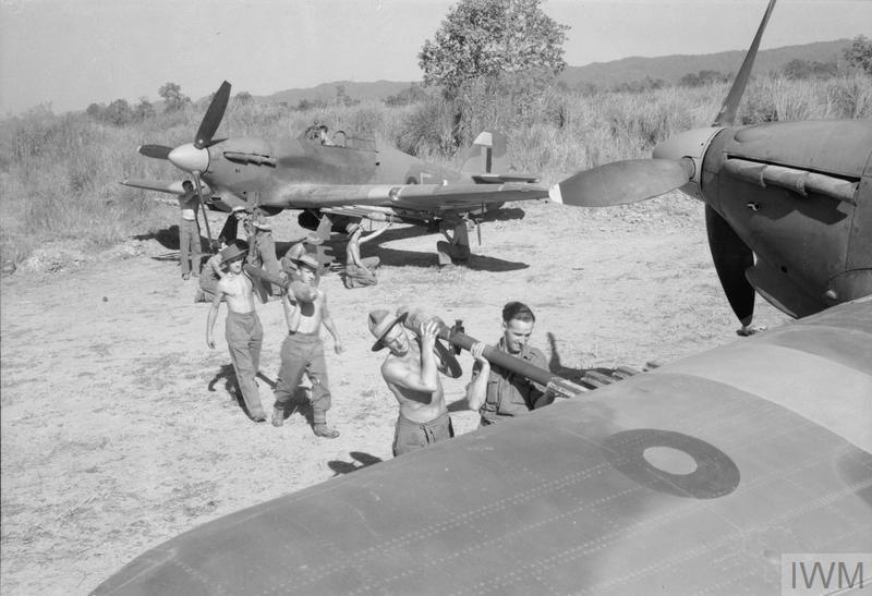 Armourers fit rocket-projectiles to Hawker Hurricane Mark IVs of No. 170 Wing in a dispersal on an airfield in Burma.