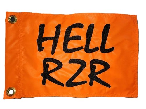 Hell rzr safety flag made by Devil Woman Flags with dense embroidered black "HELL RZR" text graphic on high-visibility orange nylon rectangle with whip sleeve