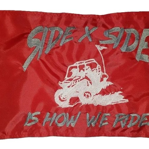 Side X Side Is How We Ride safety flag with embroidered silver and white UTV throwing roost on red nylon rectangle with whip sleeve