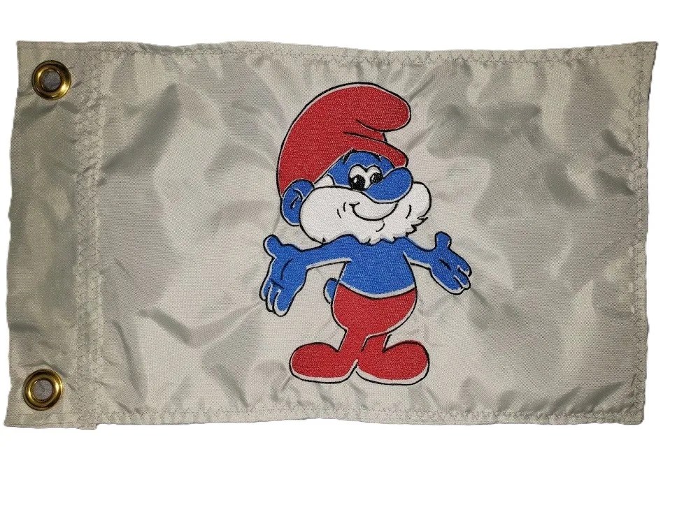 Papa Smurf safety flag with dense embroidered standing cartoon character on nylon rectangle with brass grommets