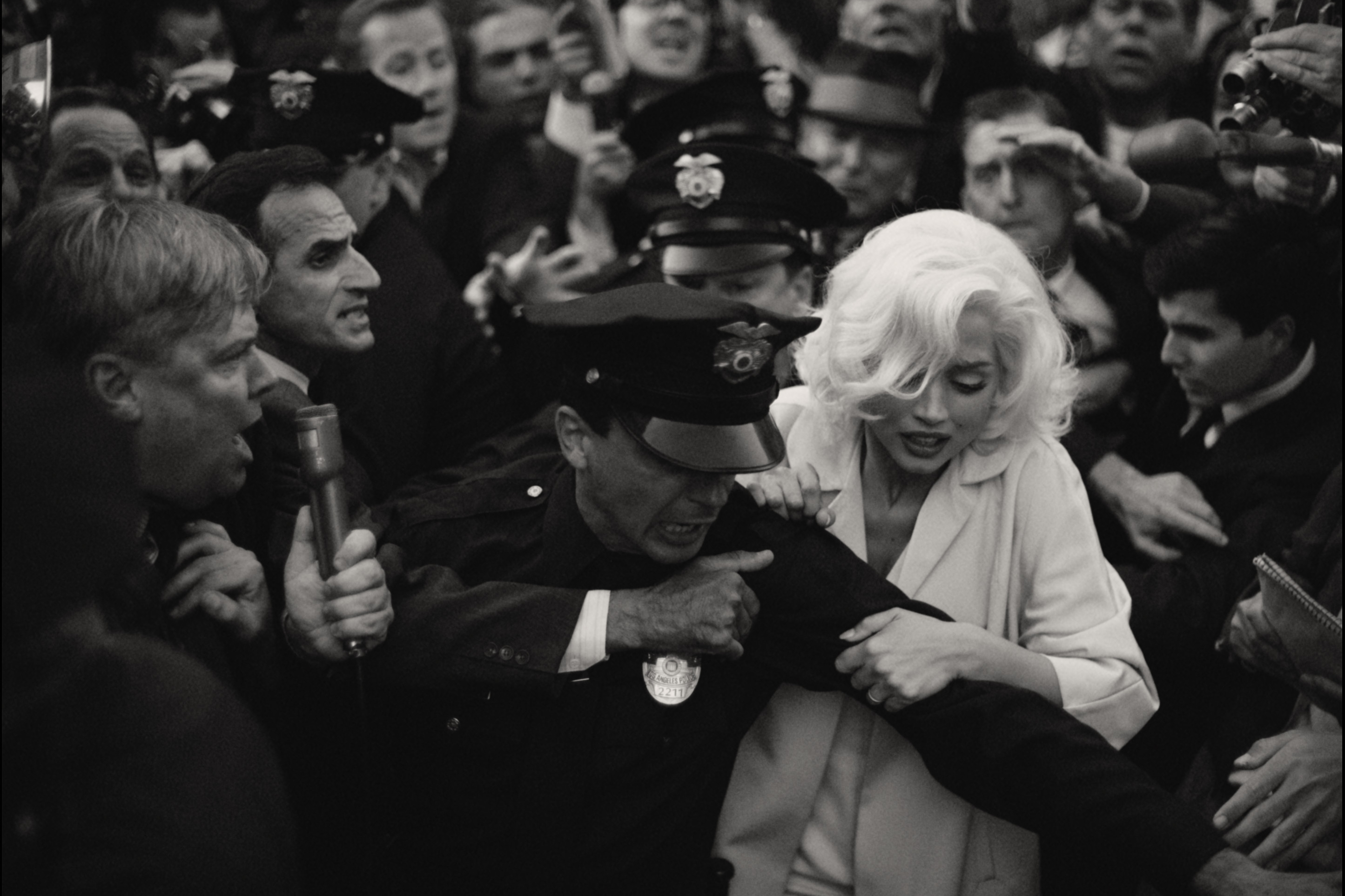 Ana de Armas pushes her way through a screaming crowd in Netflix's Blonde.