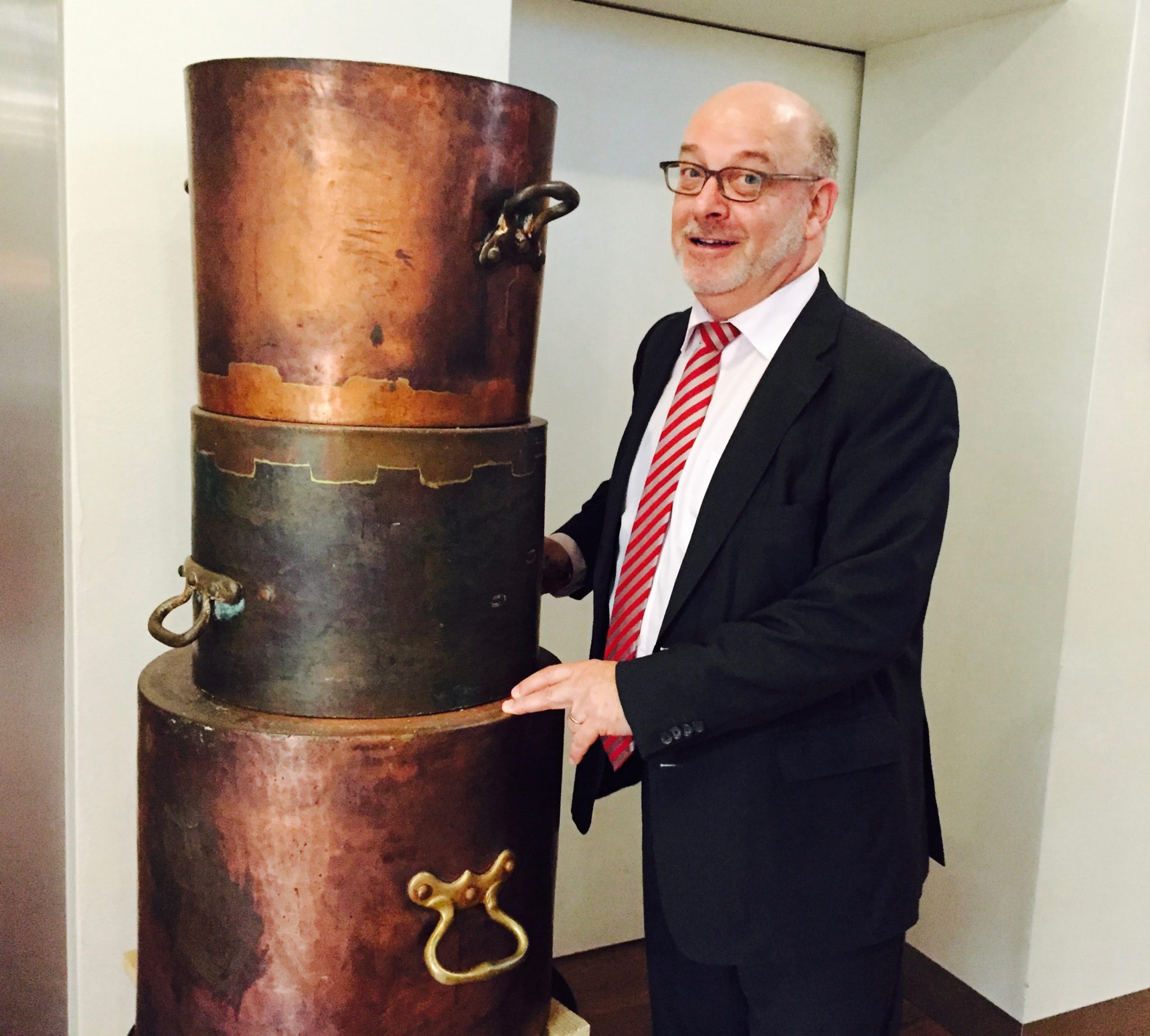 Director Fritz Erni showing off their beautiful copper pots & pans