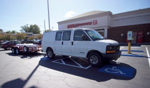 Van parked across two accessible spaces