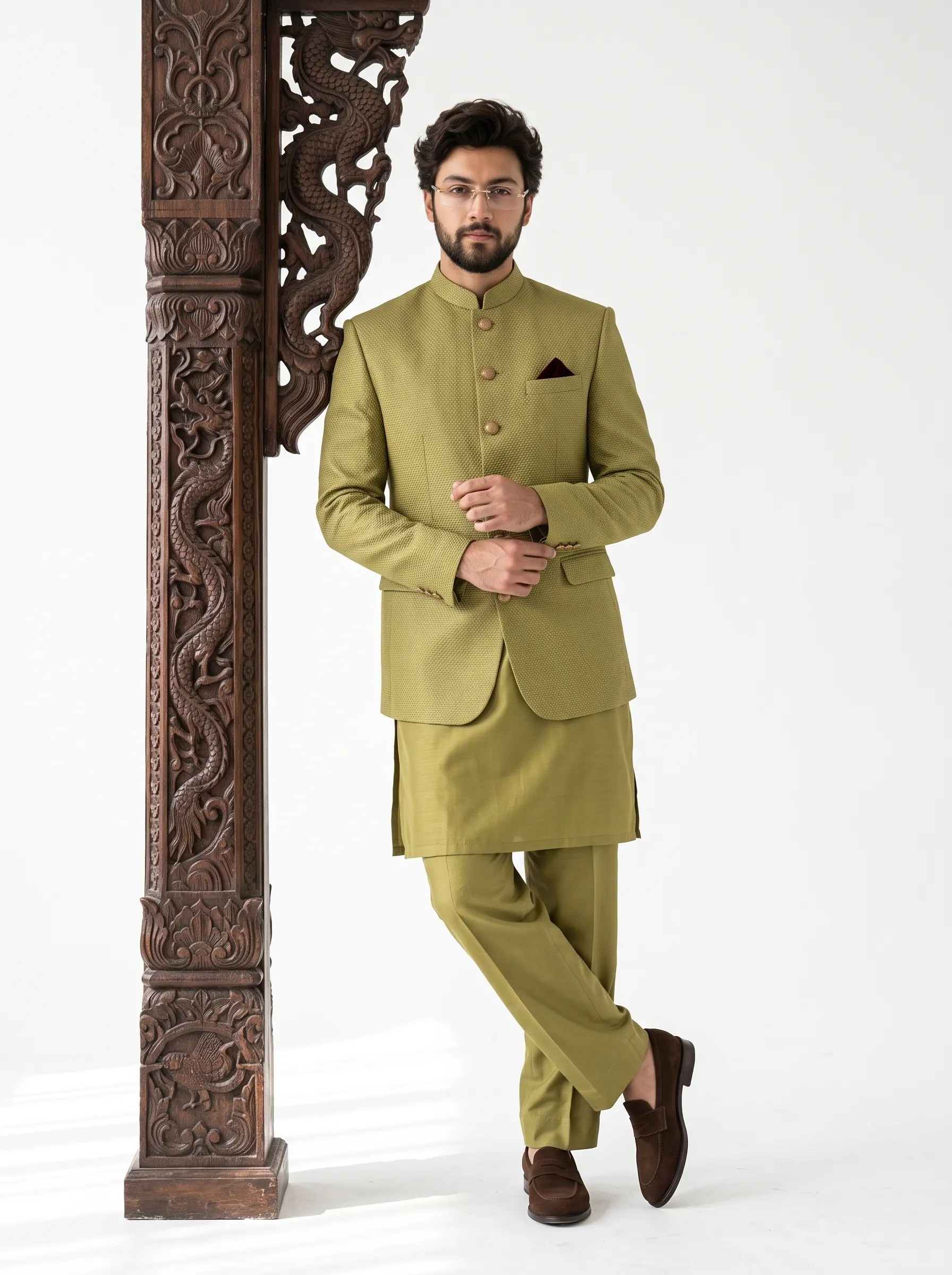 Men's olive green jacquard prince coat with Mandarin collar and textured design, paired with matching silk shalwar kameez for weddings and formal occasions.