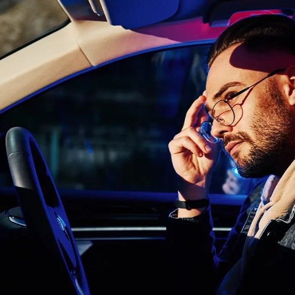 Man sitting in the drivers seat of a car