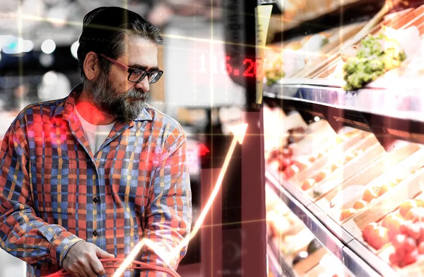 Photo of a man in grocery store looking to represent inflation in Canada