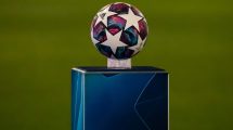 A football with white stars on a pedastal