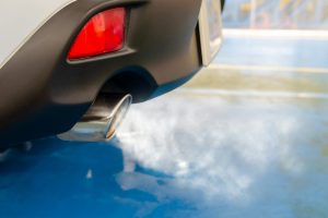 a car exhaust with fumes billowing out
