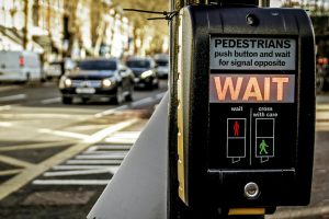 A wait sign on a pedestrian crossing