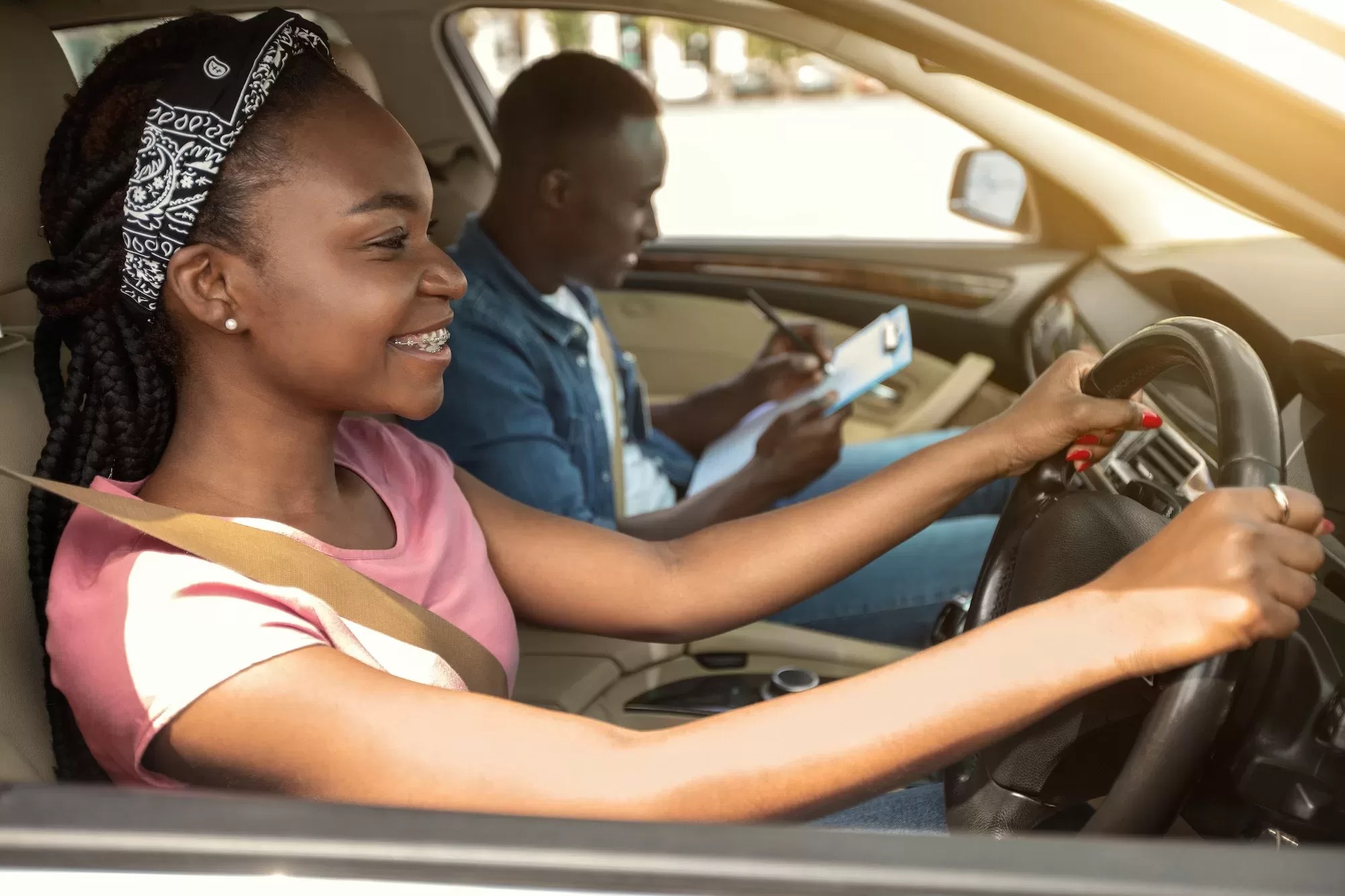 African girl taking driving test with professional instructor | How to Find the Right Driving School in Namibia: A Comprehensive Guide