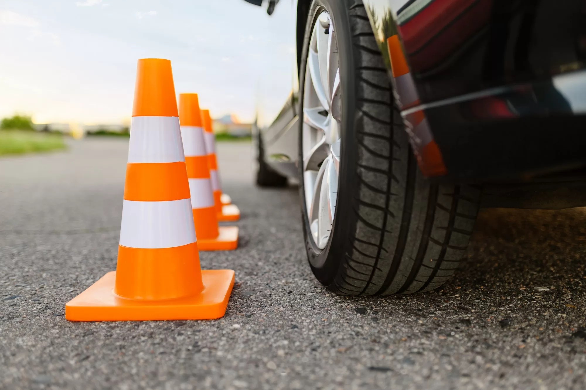 Car and traffic cones, driving school concept. NaTIS Driving Test: 10 Common Mistakes to Avoid During Your Test | Easy Guide