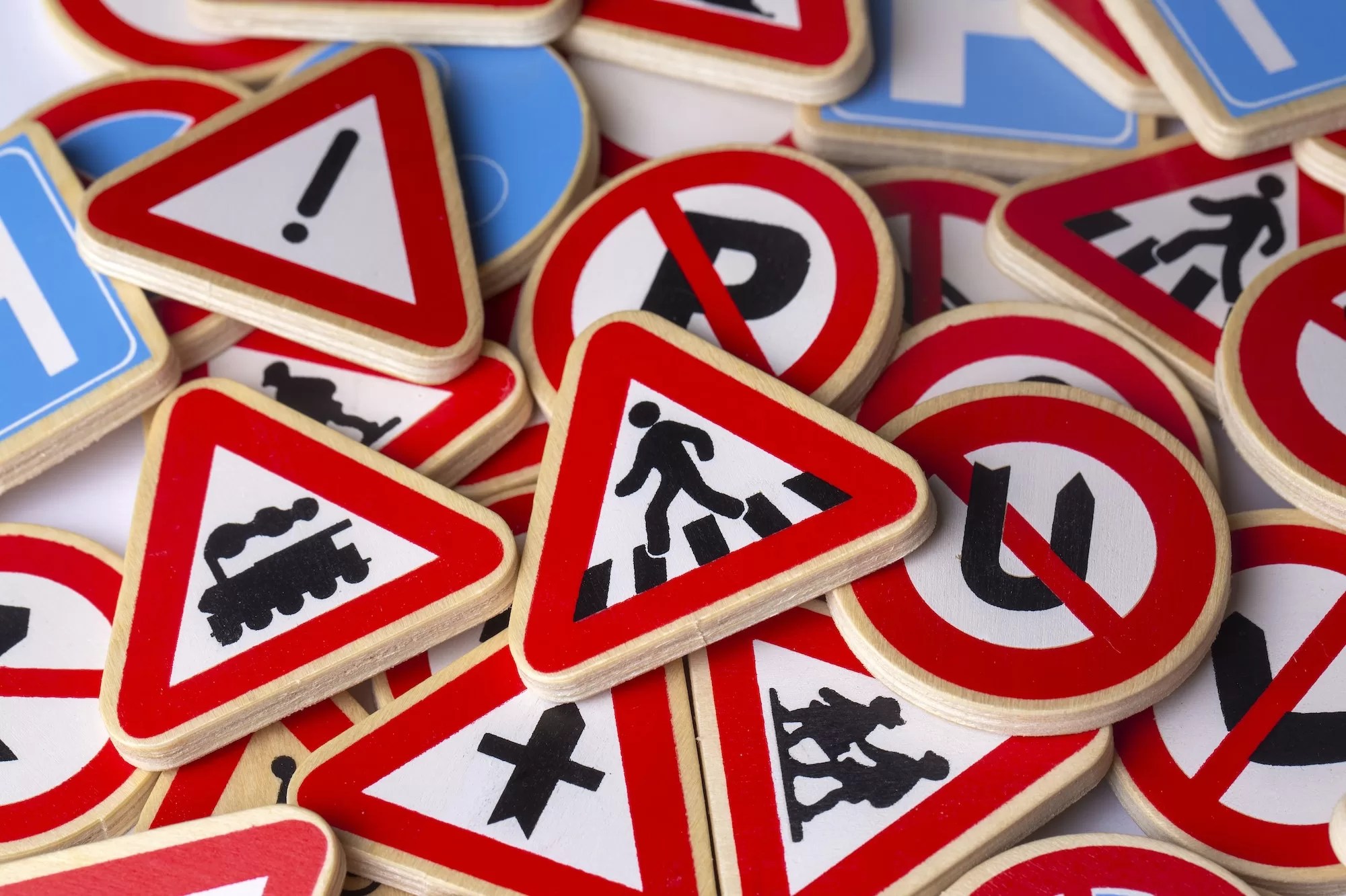 Different colored traffic signs on the white background | The best part about our NaTIS Learners Licence test preparation website?