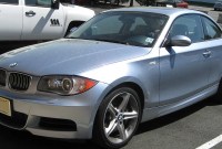 BMW 135i E82 Light blue BMW 135i E82 coupe, front three-quarter view in a parking lot