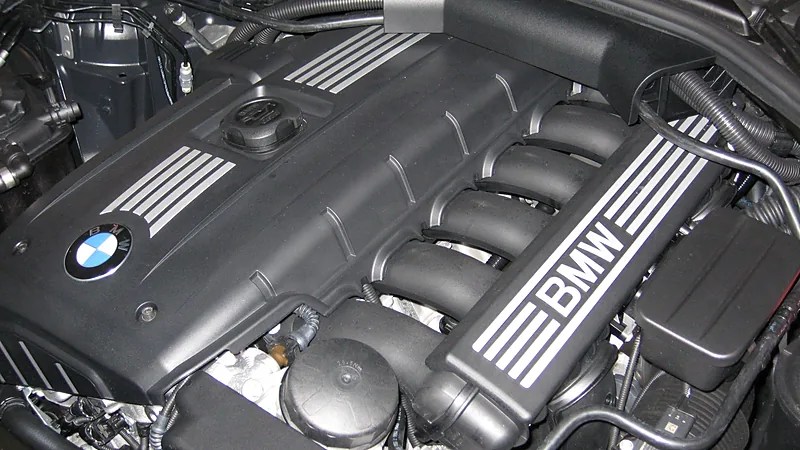 BMW N52 engine BMW N52 engine cover with the oil filler cap and the oil filter housing cap below the intake runners