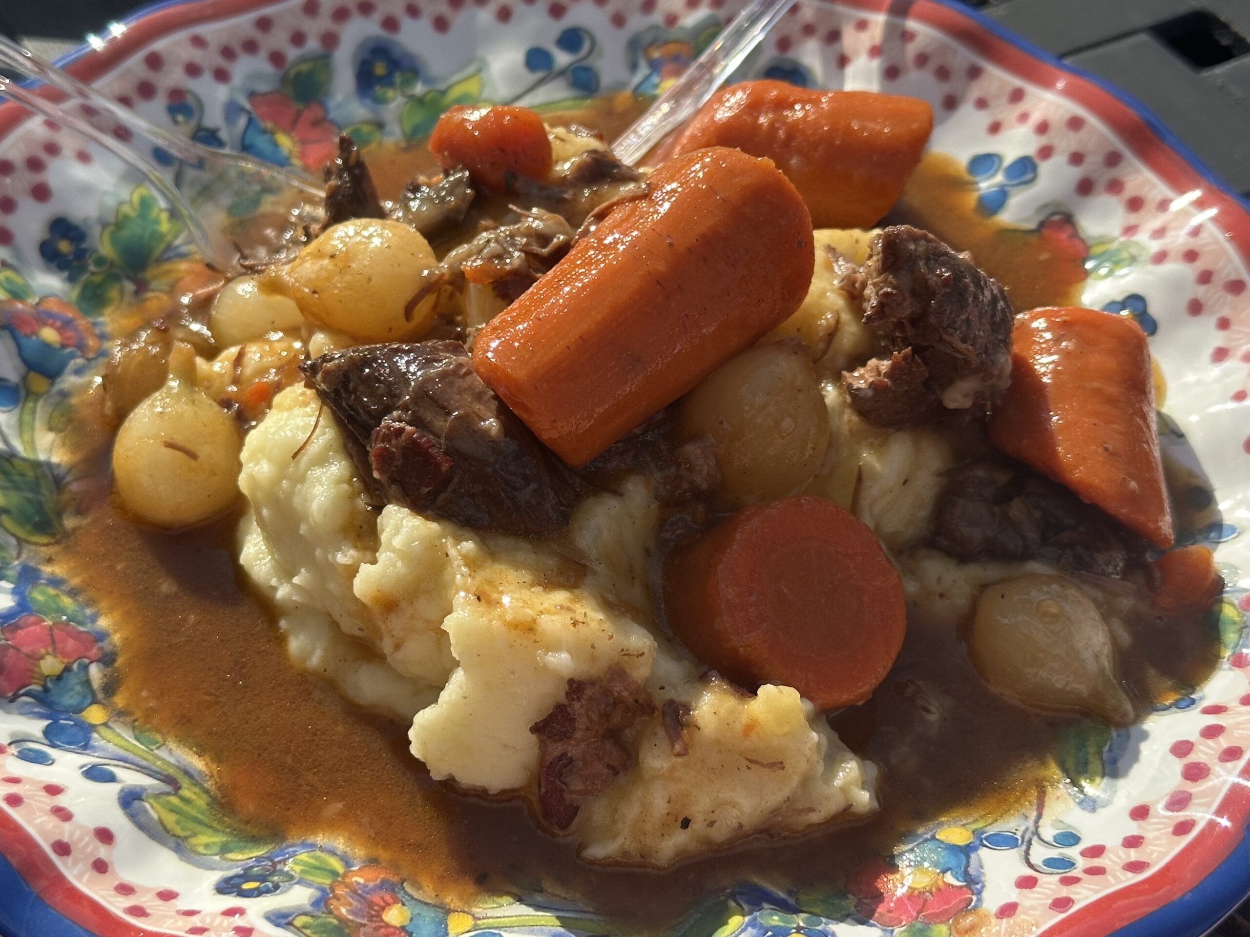beef bourguignon on plate with mashed potatoes