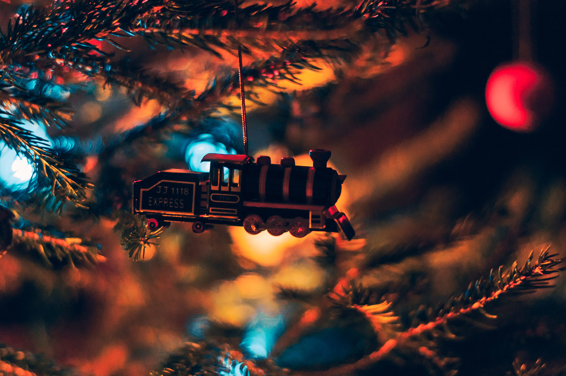 A holiday train floats amidst the Christmas adornments filled with Haps & Hols and other good cheer