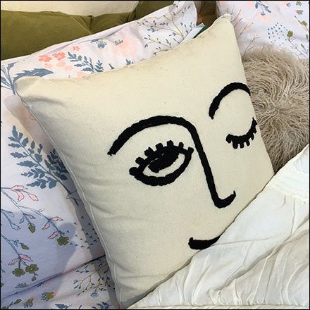 Winking Pillow Prop In Bed at Macys