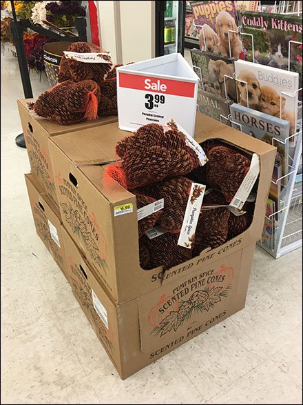 Triangular Sign For Pine Cone Merchandising