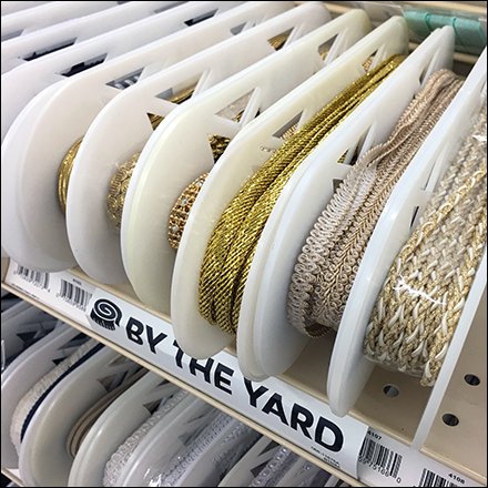 Elliptical Spool Ribbon Shelf Merchandising Feature