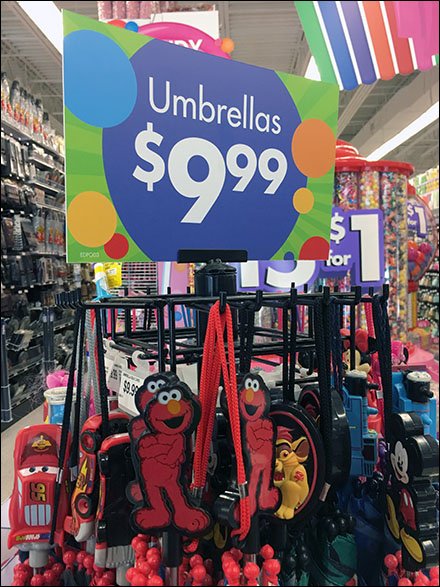 Elmo Umbrella Tree Sign As Merchandising Focus