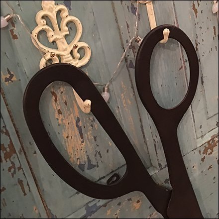 Giant Scissors Prop Cuts Through Clutter