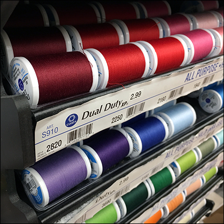 Wall-Hung Gravity-Feed Thread Rack